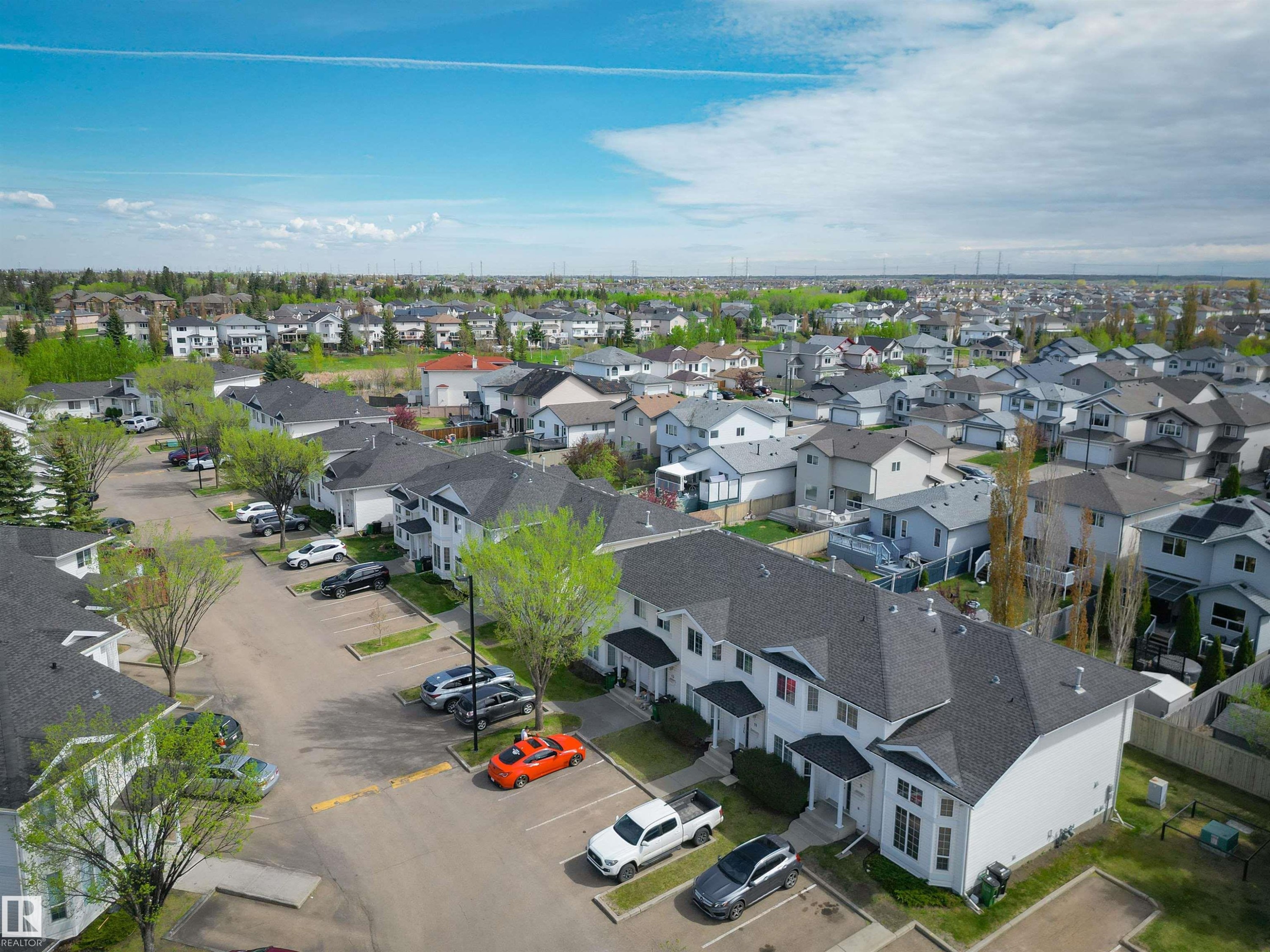 Expansive residential area featuring numerous single-family homes and multi-unit dwellings - 11 3380 28A Avenue Nw, Edmonton, AB - Outdoor With View