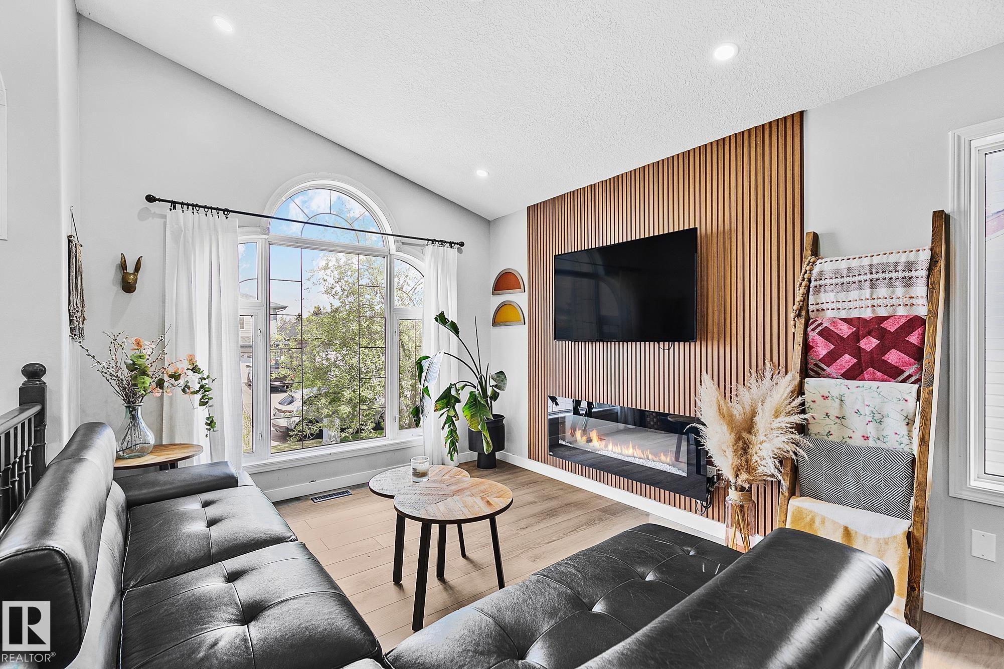 3205 41A Avenue, Edmonton, AB - Indoor Photo Showing Living Room With Fireplace