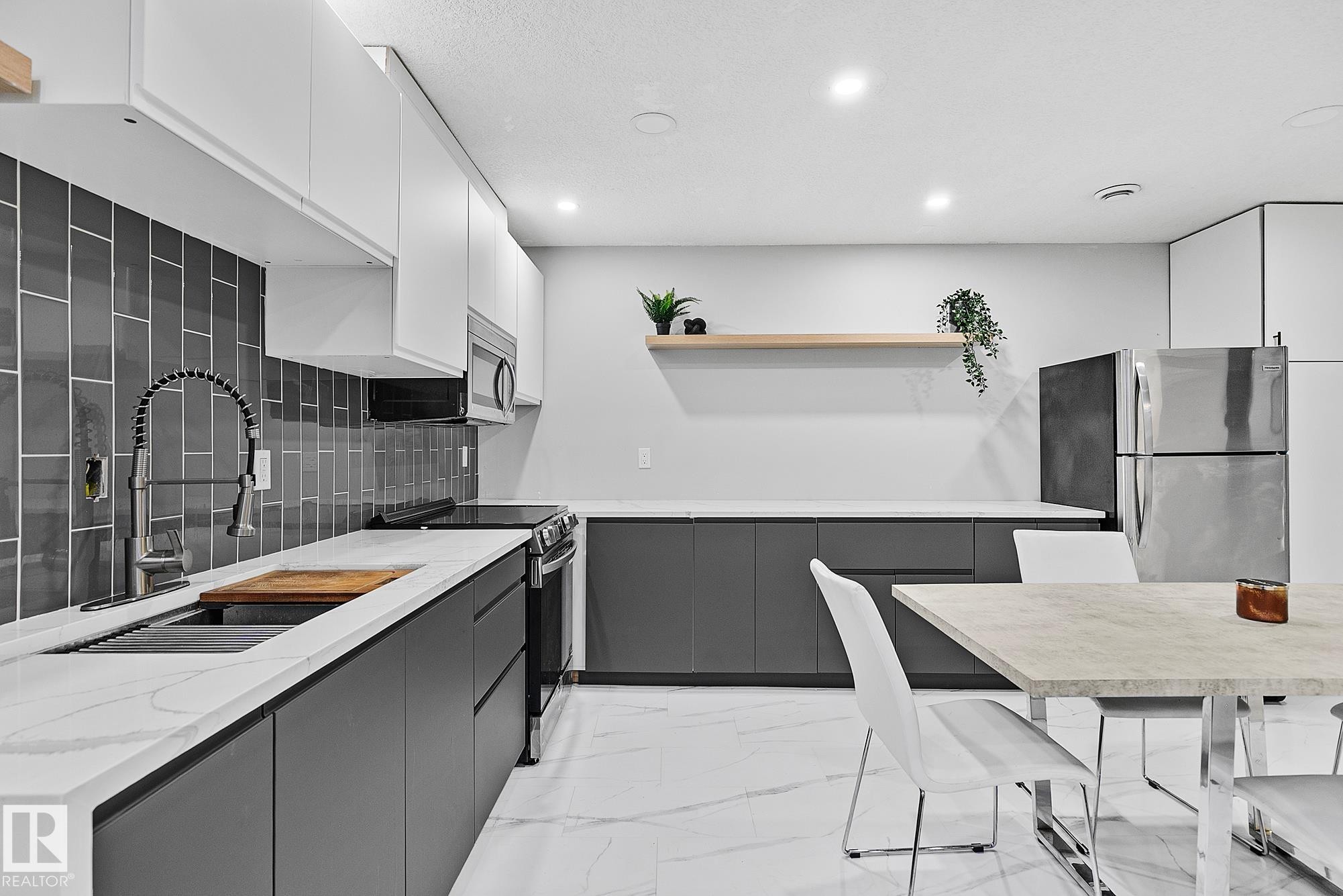 3205 41A Avenue, Edmonton, AB - Indoor Photo Showing Kitchen With Double Sink