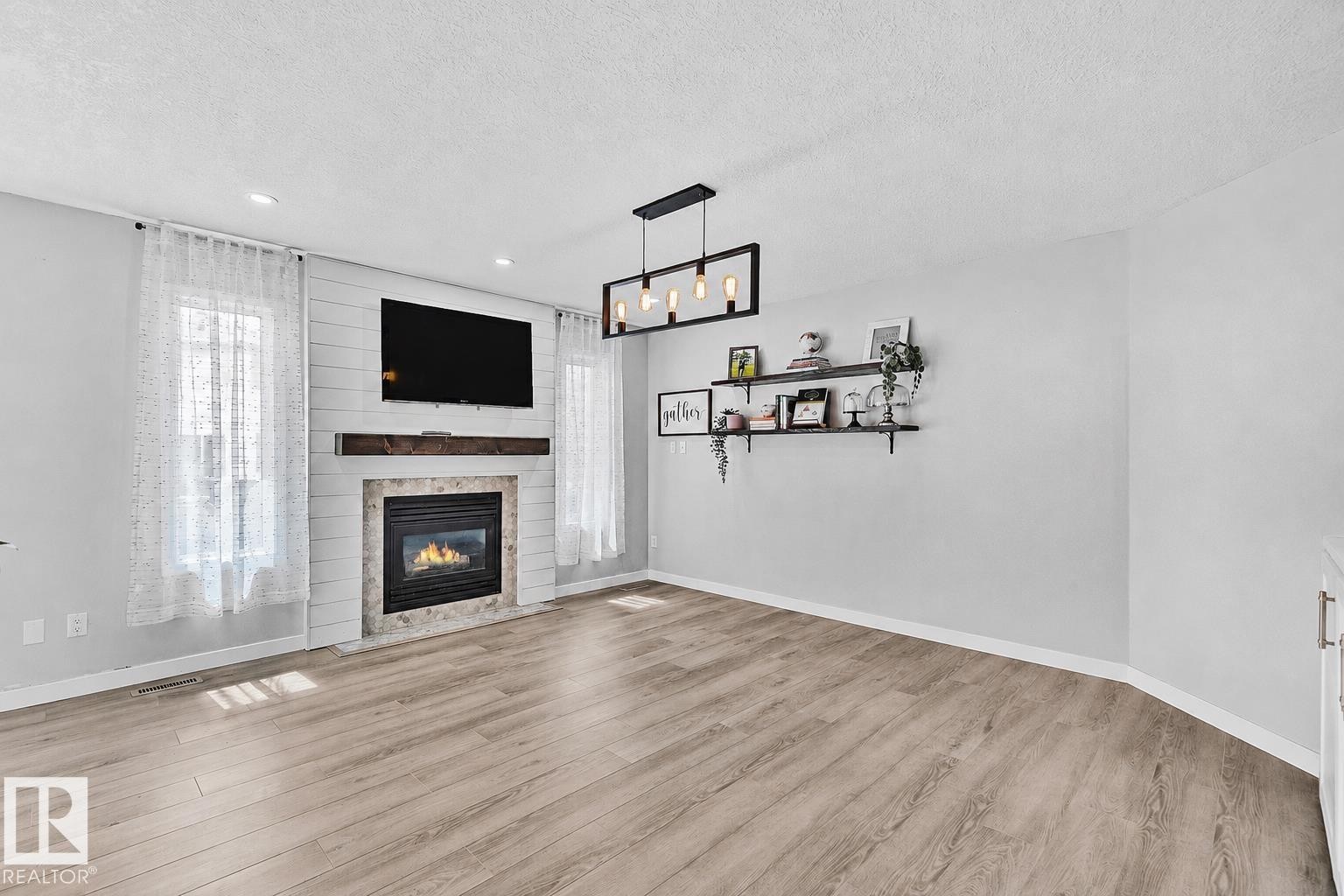 3205 41A Avenue, Edmonton, AB - Indoor Photo Showing Living Room With Fireplace