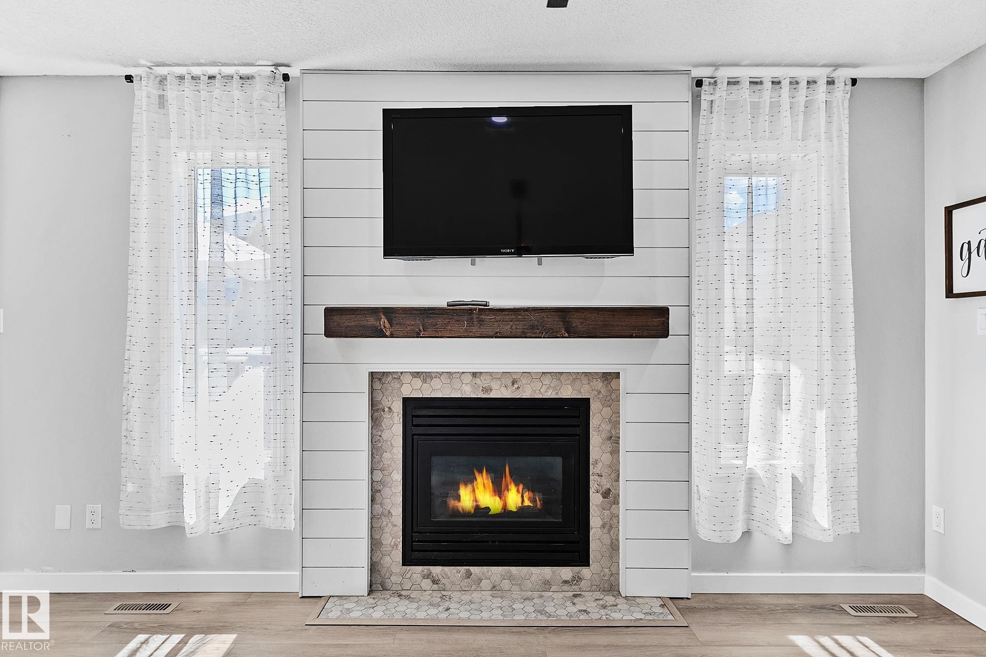 3205 41A Avenue, Edmonton, AB - Indoor Photo Showing Living Room With Fireplace