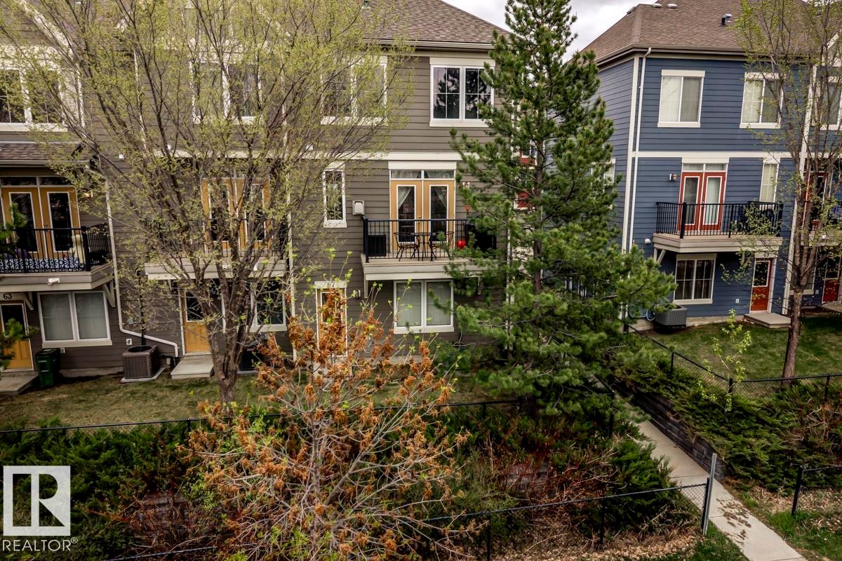 Multi-level townhome featuring a private balcony with black metal railing - 67 603 Watt Boulevard, Edmonton, AB - Outdoor