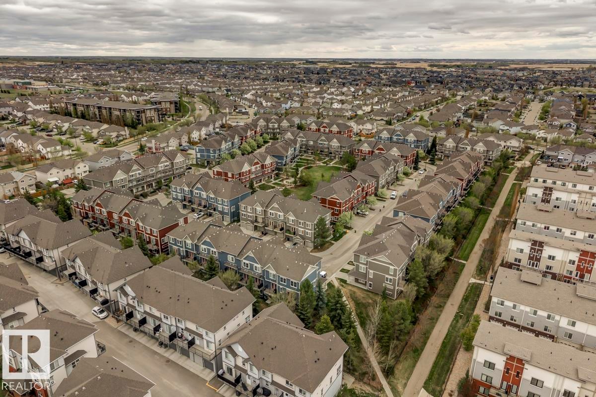 Expansive residential community featuring a variety of housing types, including single-detached homes, townhomes, and multi-story buildings - 67 603 Watt Boulevard, Edmonton, AB - Outdoor With View