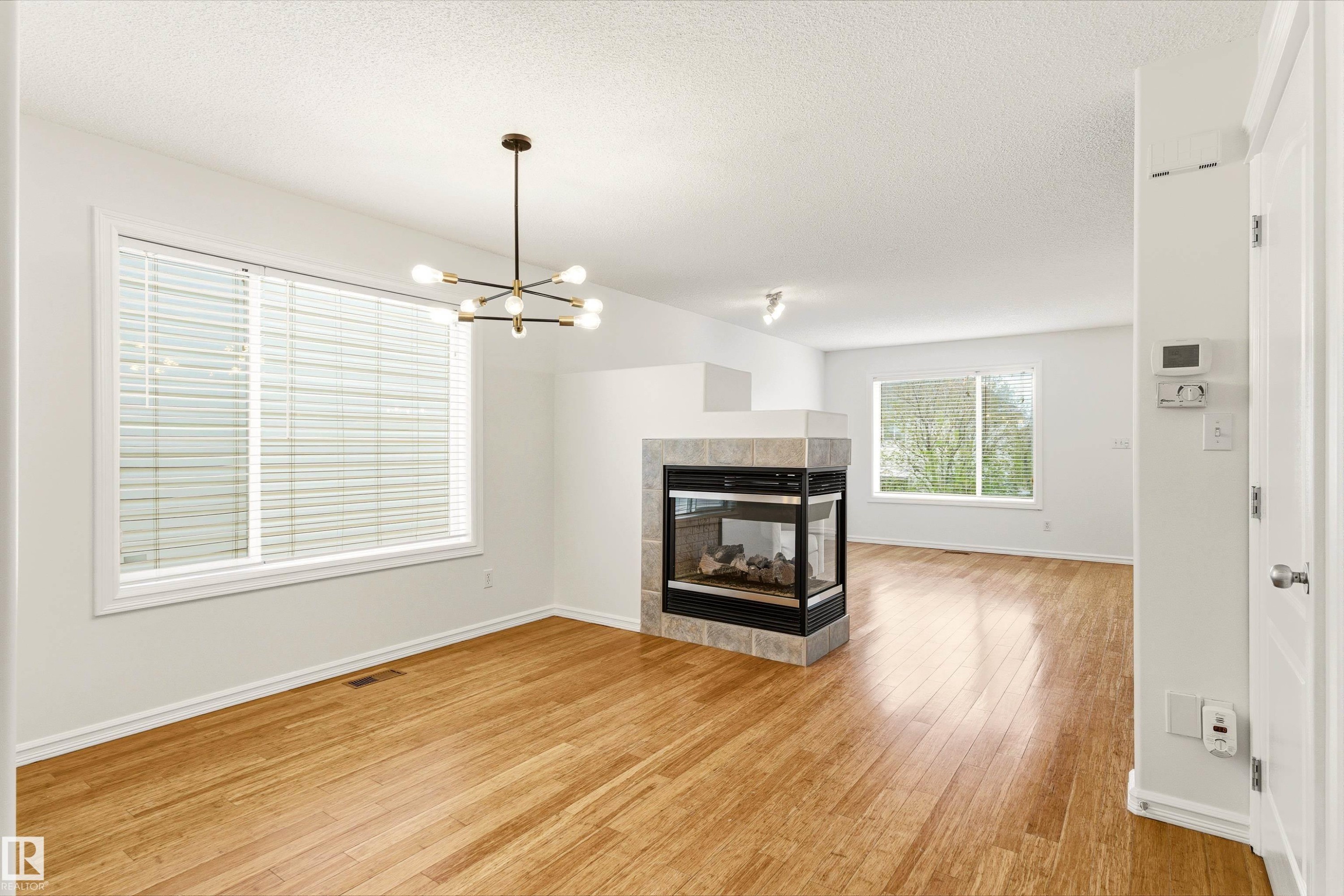 2550 Rabbit Hill Road, Edmonton, AB - Indoor Photo Showing Living Room With Fireplace