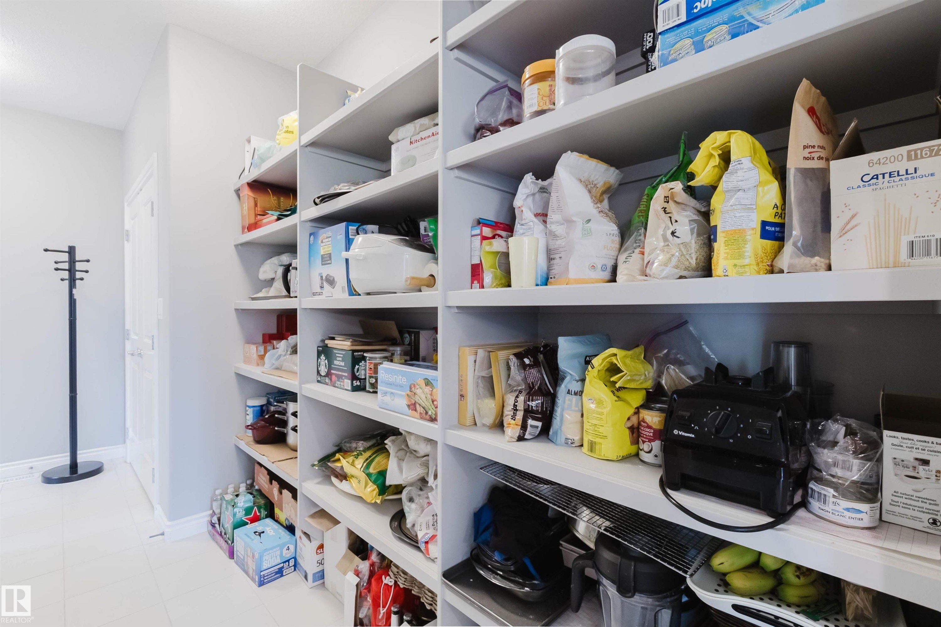 Expansive pantry featuring built-in shelving, providing extensive storage options - 3571 Keswick Boulevard, Edmonton, AB - Indoor With Storage