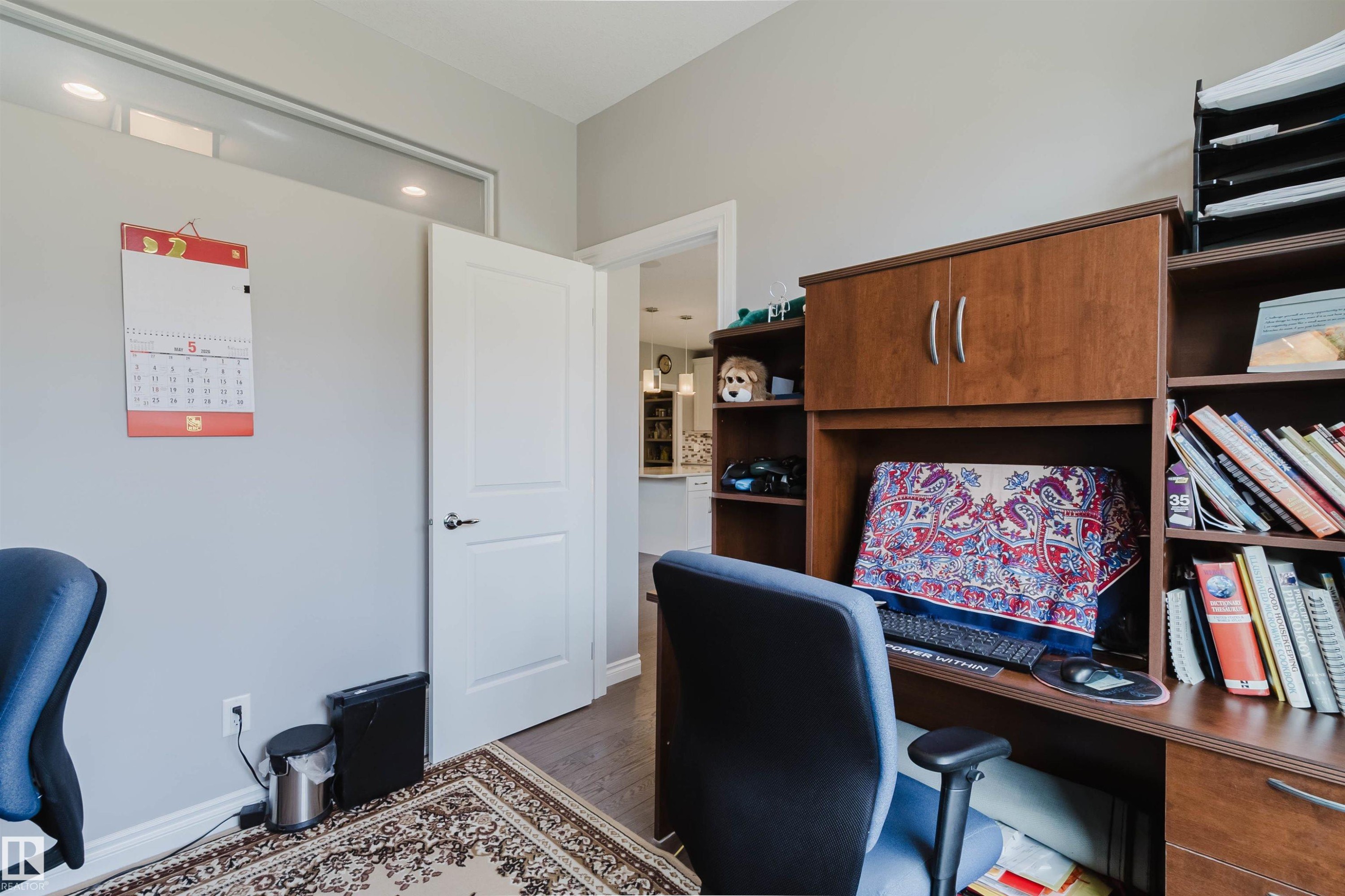 Home office space featuring warm gray walls and dark wood-finish flooring - 3571 Keswick Boulevard, Edmonton, AB - Indoor Photo Showing Office