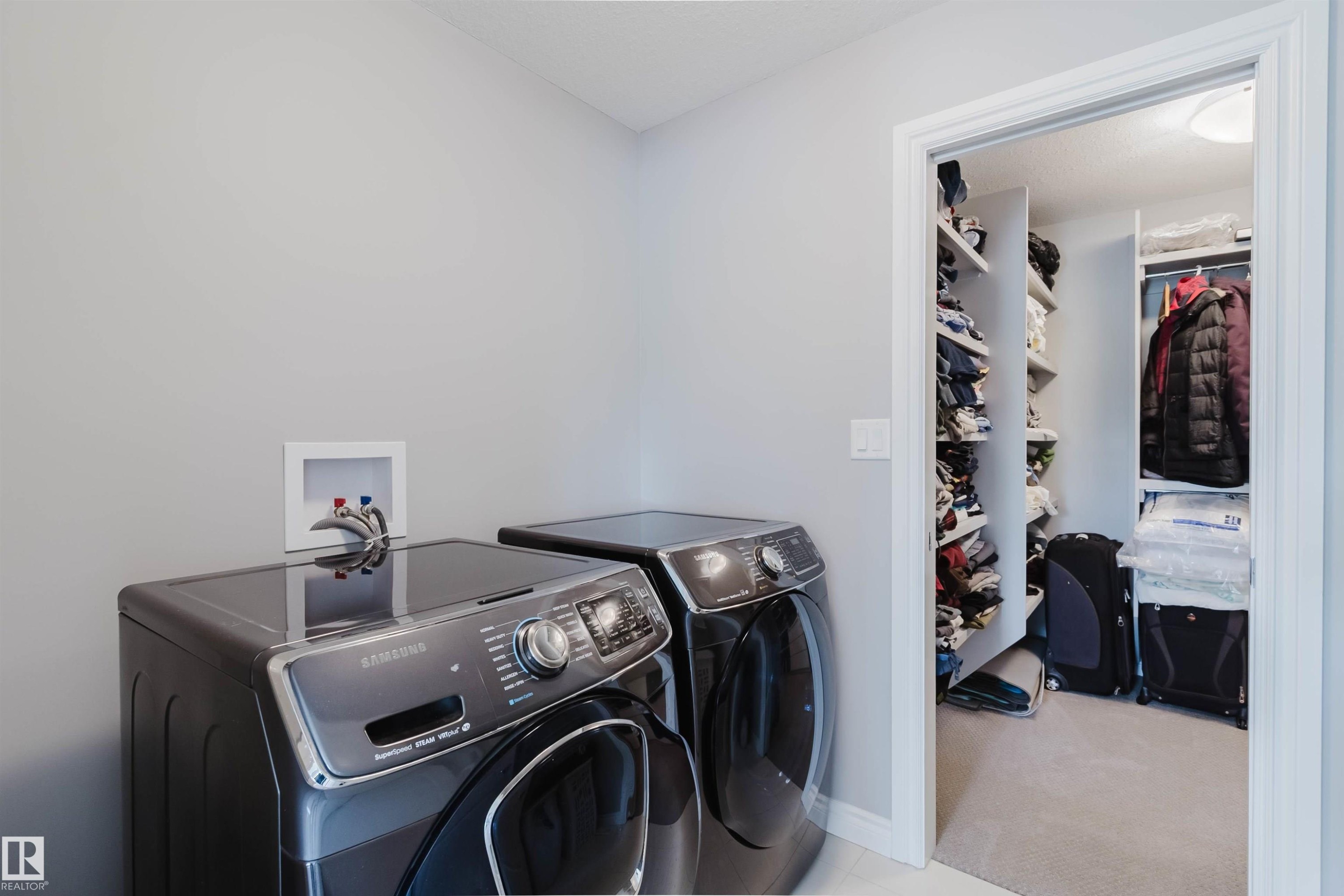 Dedicated laundry area featuring a wall-mounted utility box - 3571 Keswick Boulevard, Edmonton, AB - Indoor Photo Showing Laundry Room