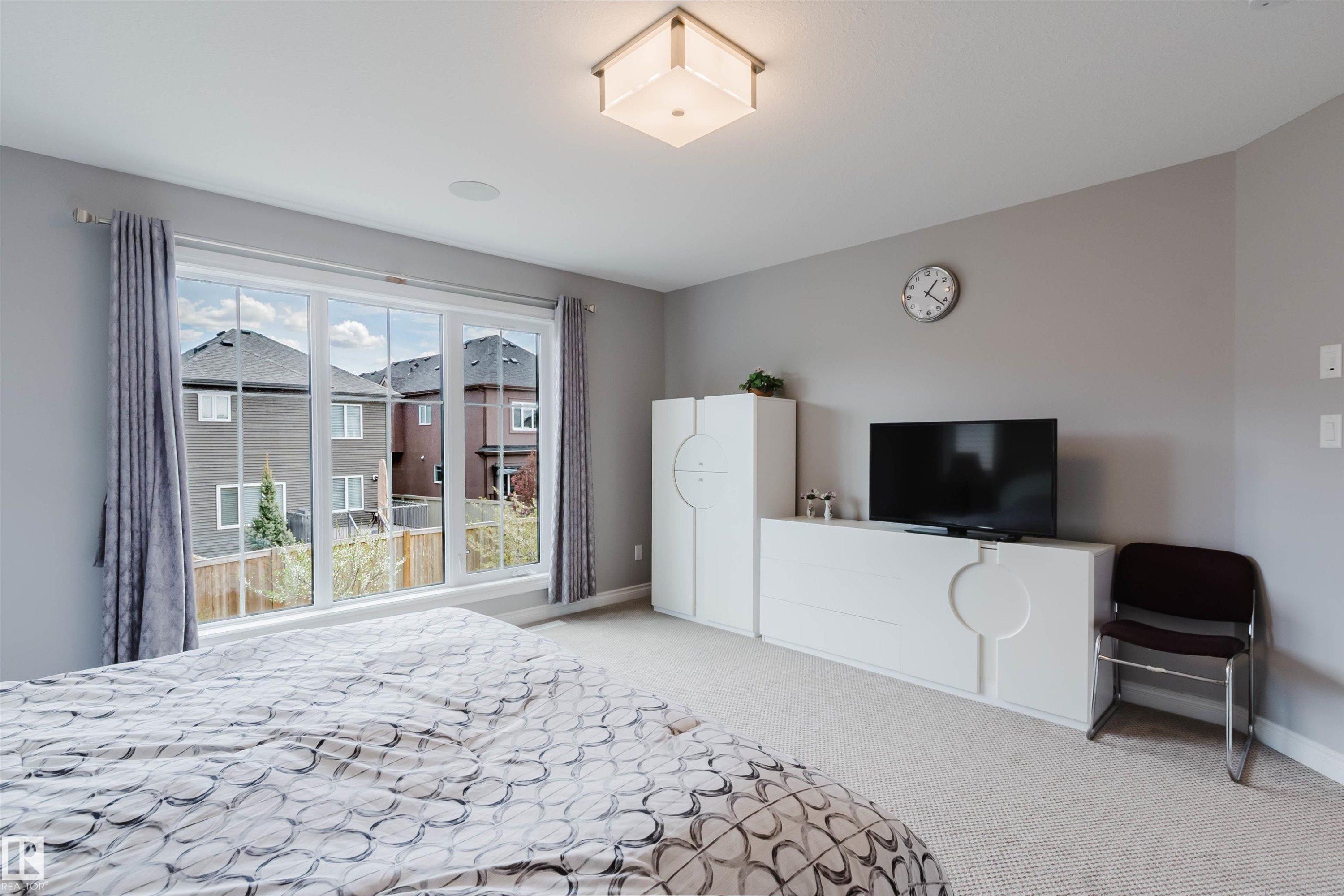 Wide picture window with white trim - 3571 Keswick Boulevard, Edmonton, AB - Indoor Photo Showing Bedroom