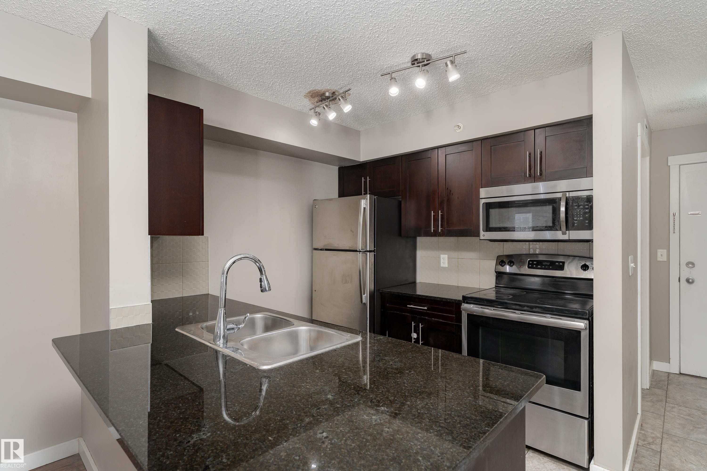 409 5804 Mullen Place, Edmonton, AB - Indoor Photo Showing Kitchen With Stainless Steel Kitchen With Double Sink With Upgraded Kitchen