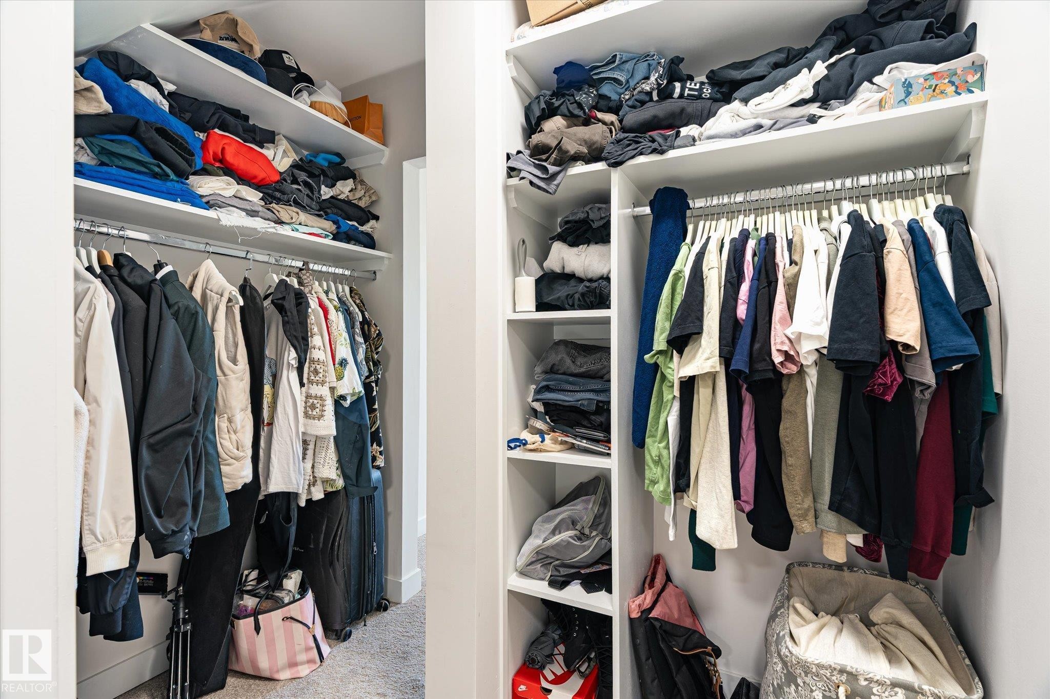Custom closet system featuring multiple hanging rods, integrated shelving, and a neutral color palette - 108 10105 95 Street, Edmonton, AB - Indoor With Storage