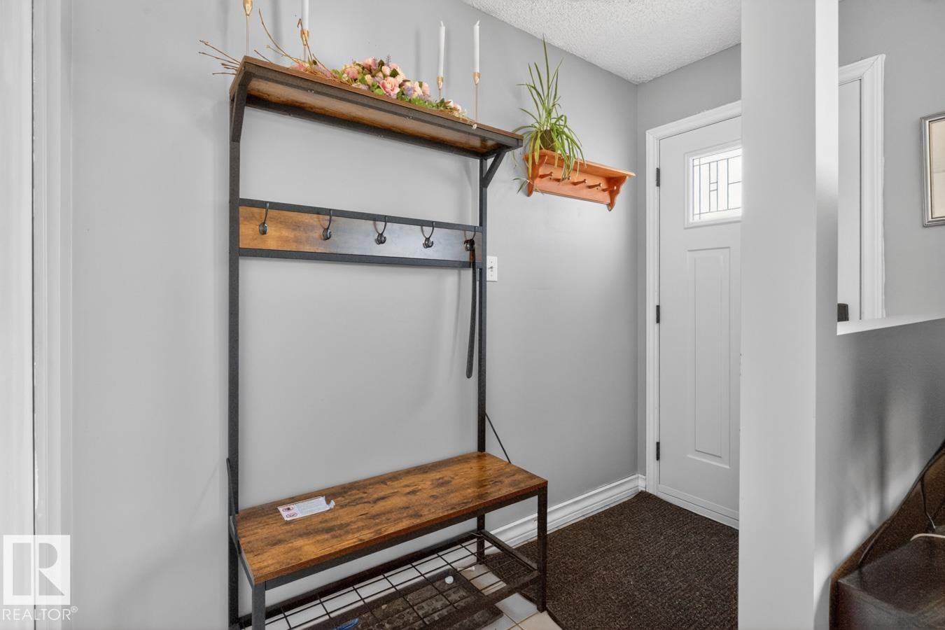 Front Foyer/Entrance into Home featuring bench space for coats/shoes. - 18655 61 Avenue, Edmonton, AB - Indoor Photo Showing Other Room