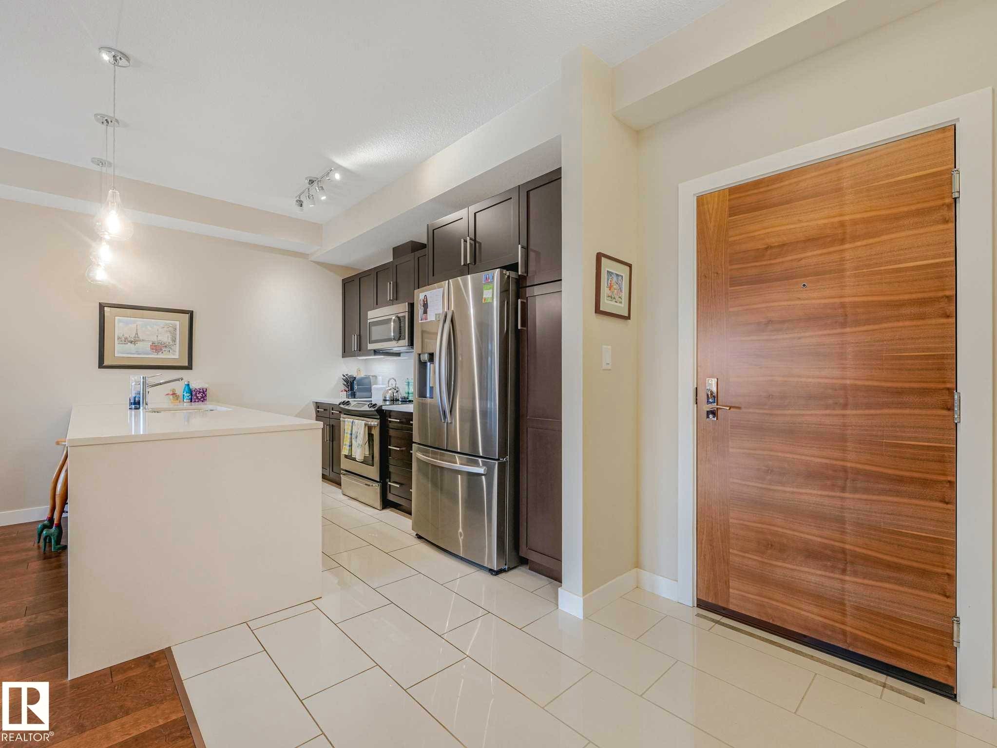 Image quality insufficient for description - 213 625 Leger Way, Edmonton, AB - Indoor Photo Showing Kitchen