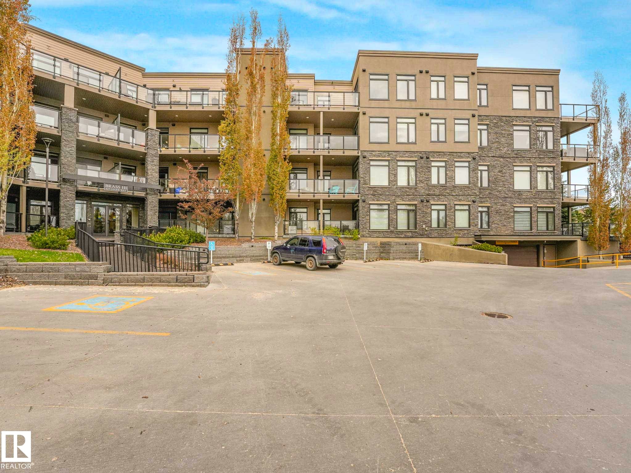 Image quality insufficient for description - 213 625 Leger Way, Edmonton, AB - Outdoor With Balcony With Facade