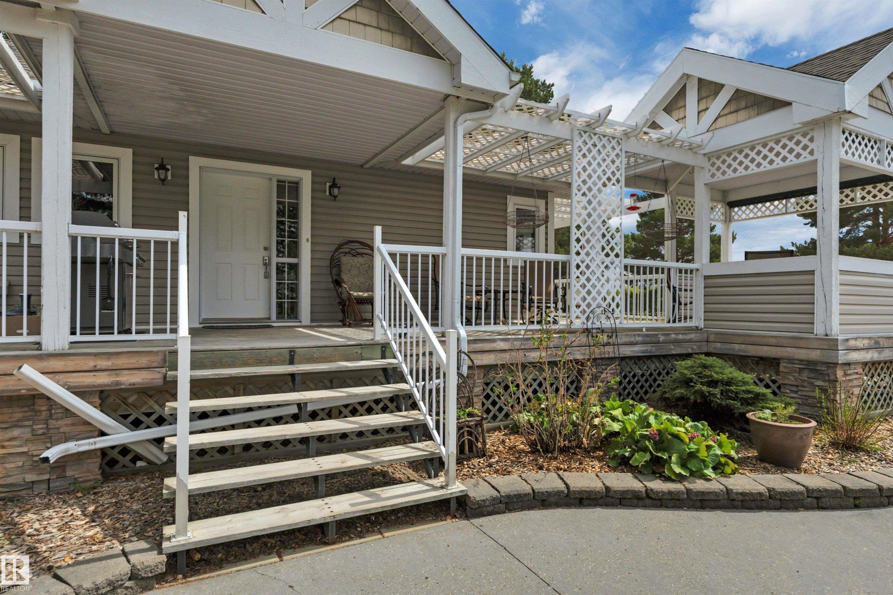 464012 A Rge Road 233, Rural Wetaskiwin County, AB - Outdoor With Deck Patio Veranda With Facade