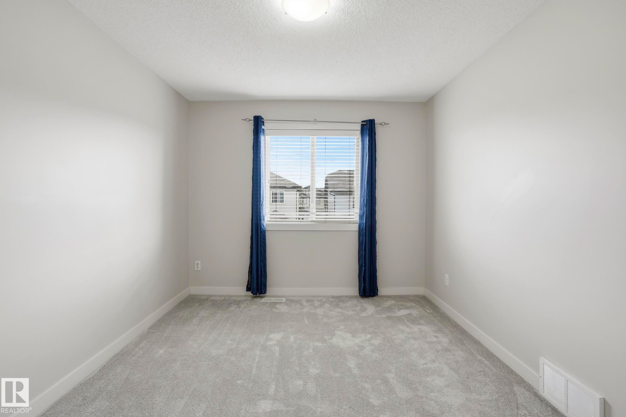 Carpeted room with a central window - 2917 16A Avenue, Edmonton, AB - Indoor Photo Showing Other Room