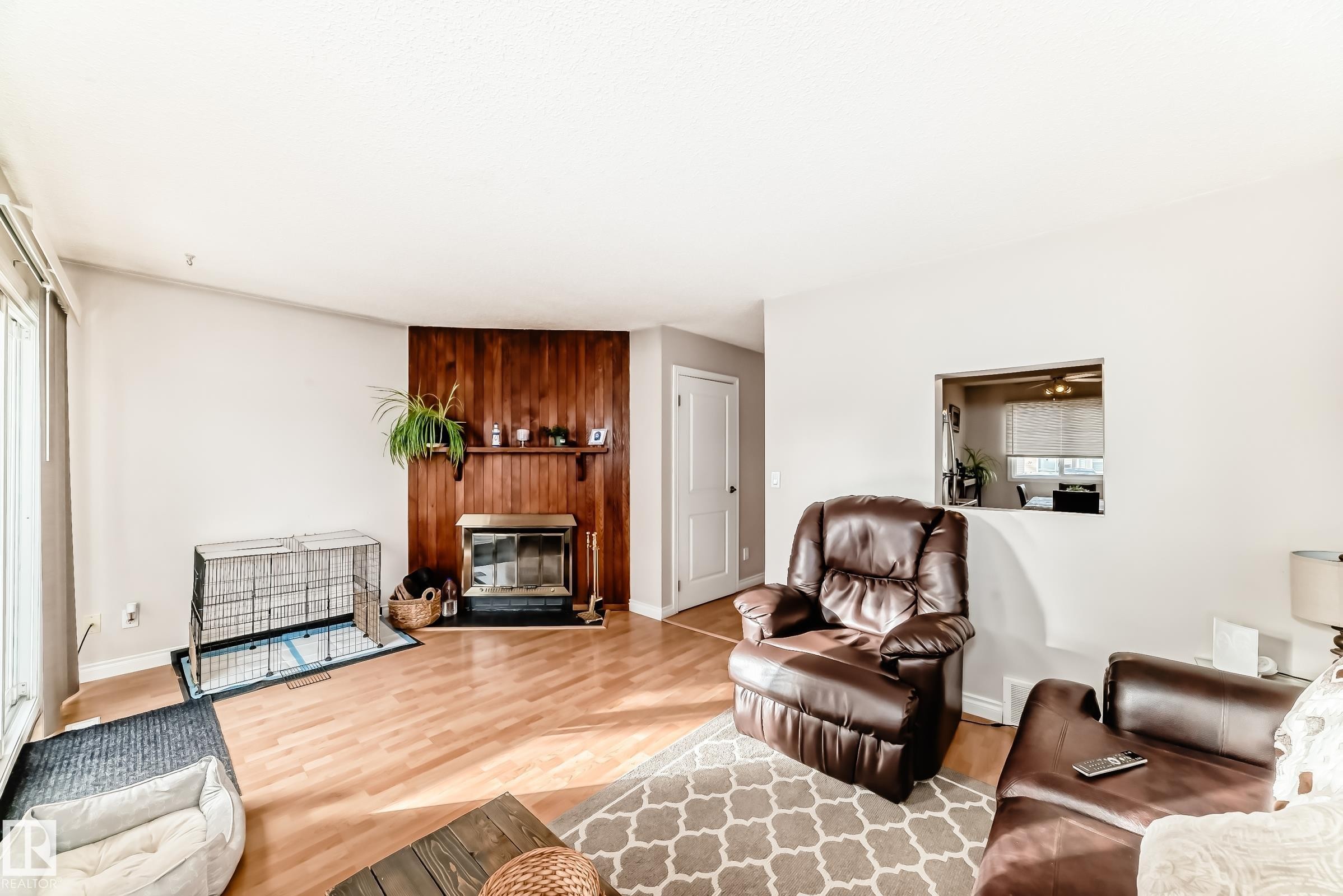 18 10453 20 Avenue, Edmonton, AB - Indoor Photo Showing Living Room With Fireplace