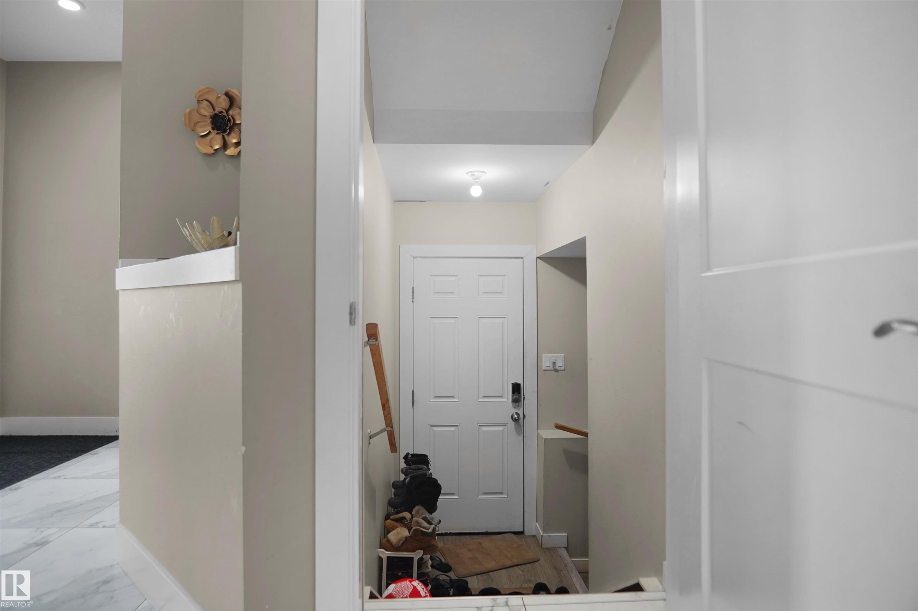 Entryway featuring a white paneled door, light neutral wall colors, and a recessed ceiling light - 6108 173 Ave, Edmonton, AB - Indoor Photo Showing Other Room