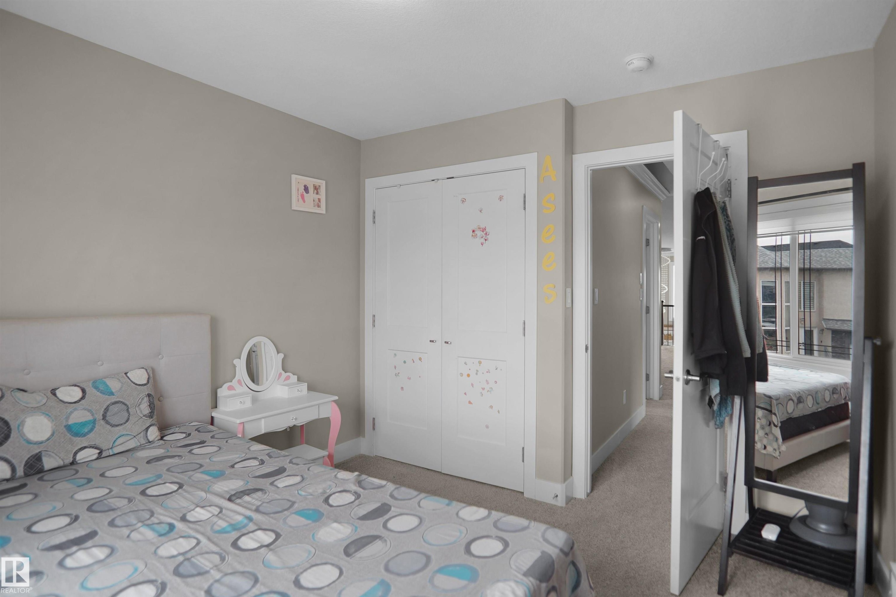Bedroom featuring neutral wall color, white trim, and carpet flooring - 6108 173 Ave, Edmonton, AB - Indoor Photo Showing Bedroom
