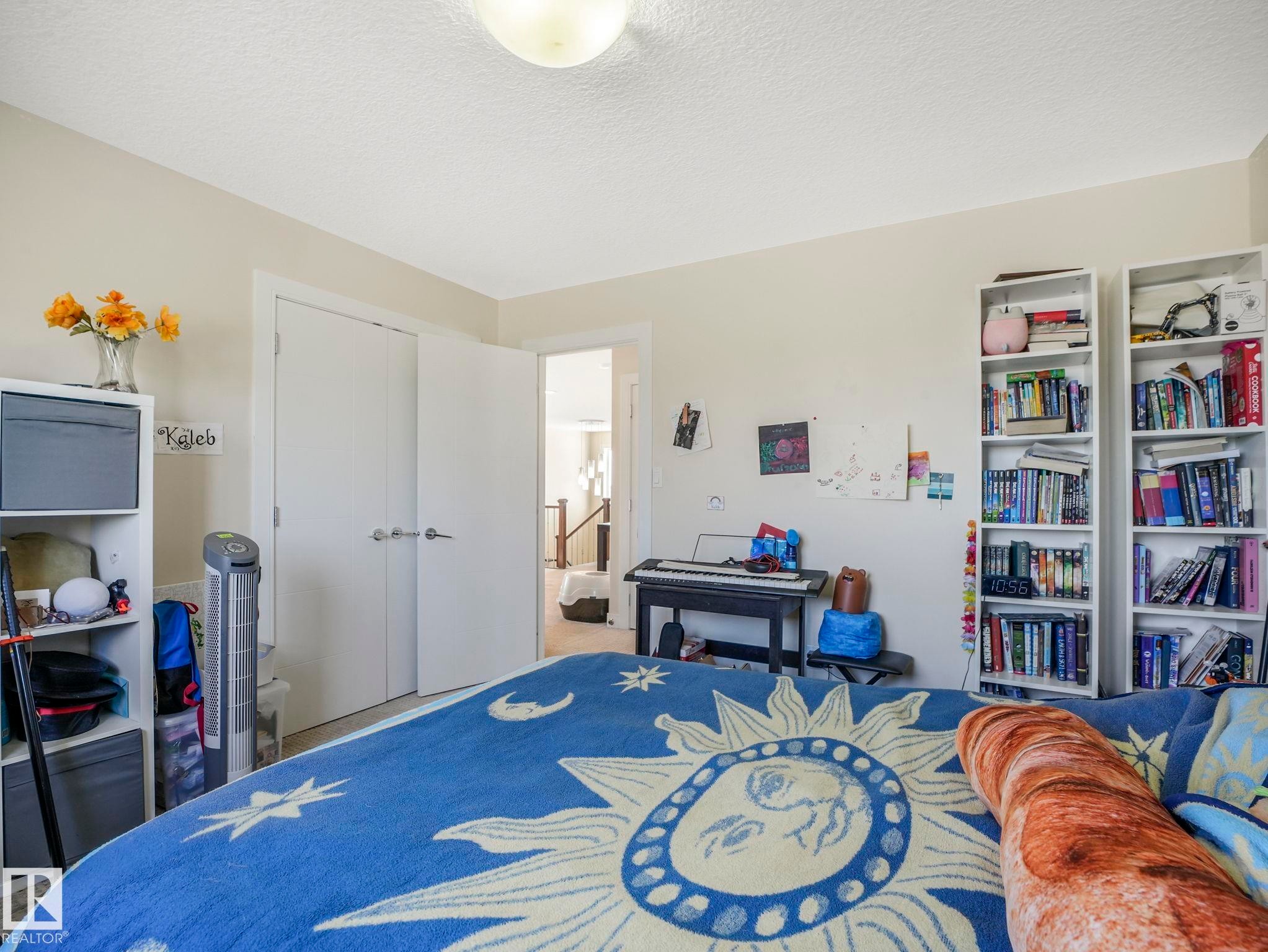 Spacious room featuring neutral painted walls and a flush-mount ceiling light fixture - 3910 49 Avenue, Beaumont, AB - Indoor Photo Showing Bedroom