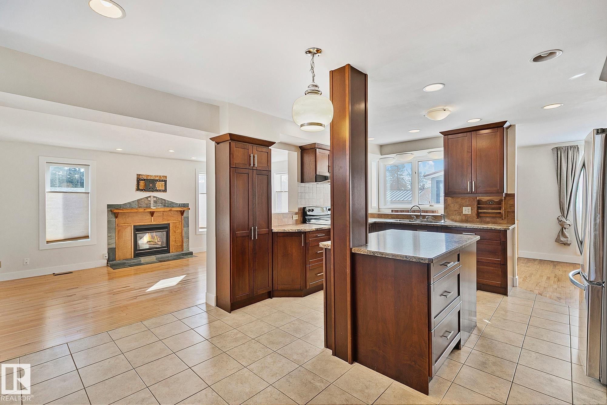 10823 130 Street, Edmonton, AB - Indoor Photo Showing Kitchen With Fireplace