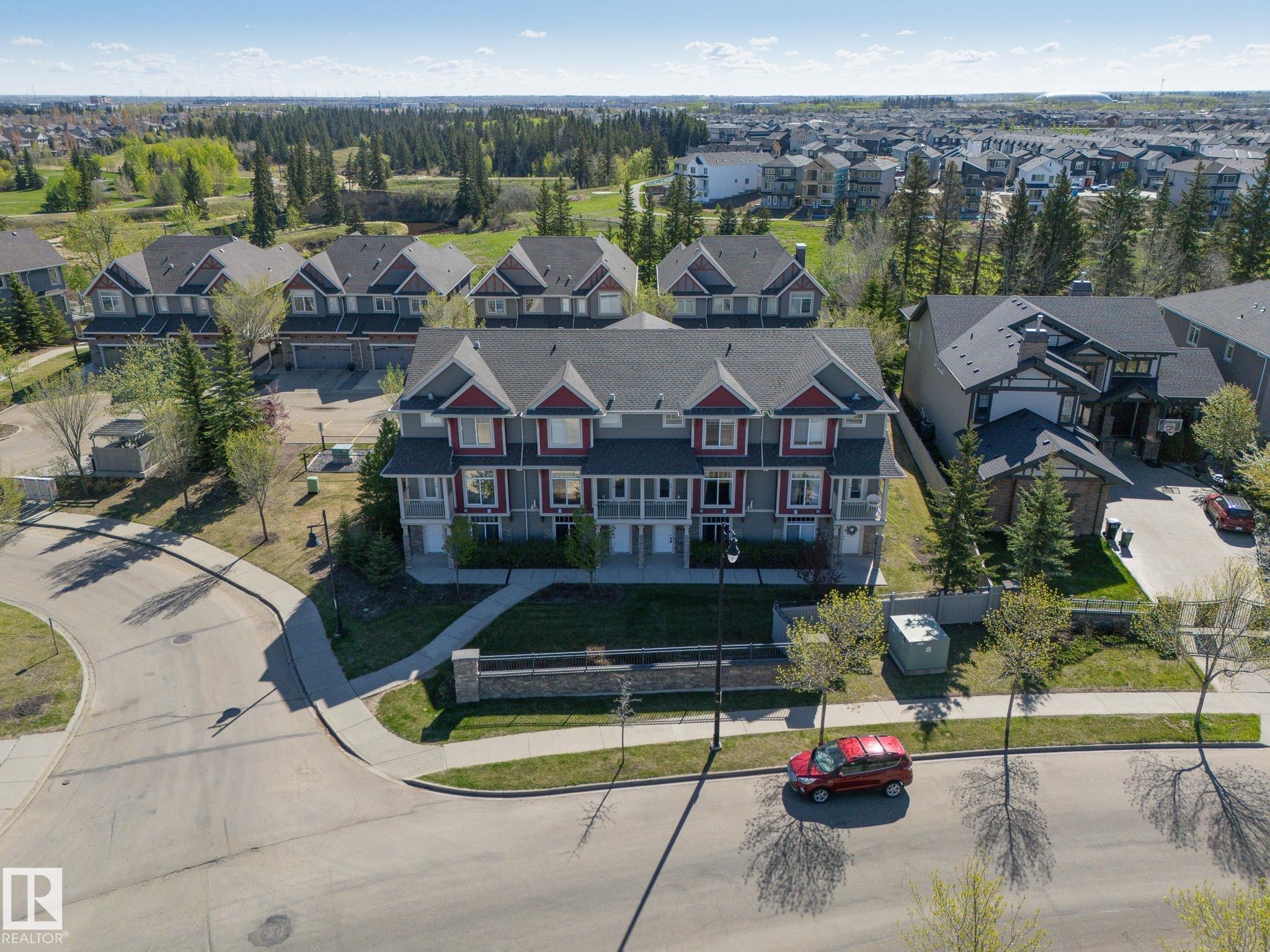 Modern multi-unit residence with grey siding and red trim accents - 117 Callaghan Drive Sw, Edmonton, AB - Outdoor With Facade With View