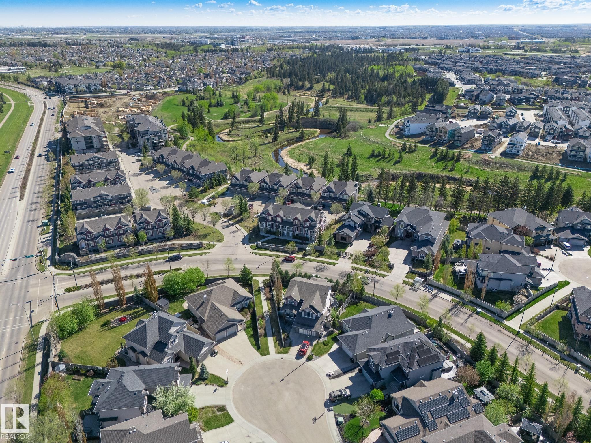 Aerial perspective showcasing a residential community with varied housing styles - 117 Callaghan Drive Sw, Edmonton, AB - Outdoor With View
