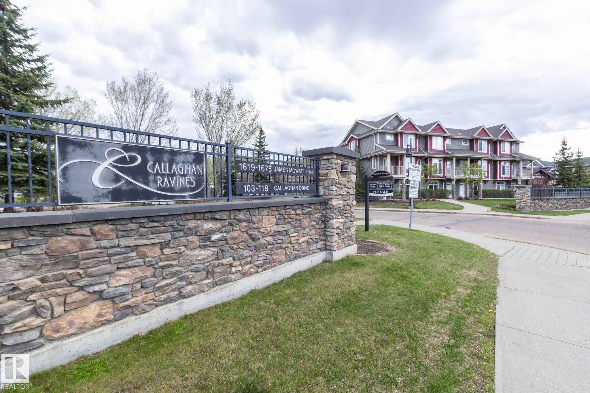 Stone veneer and wrought iron fencing define the property entrance - 117 Callaghan Drive Sw, Edmonton, AB - Outdoor