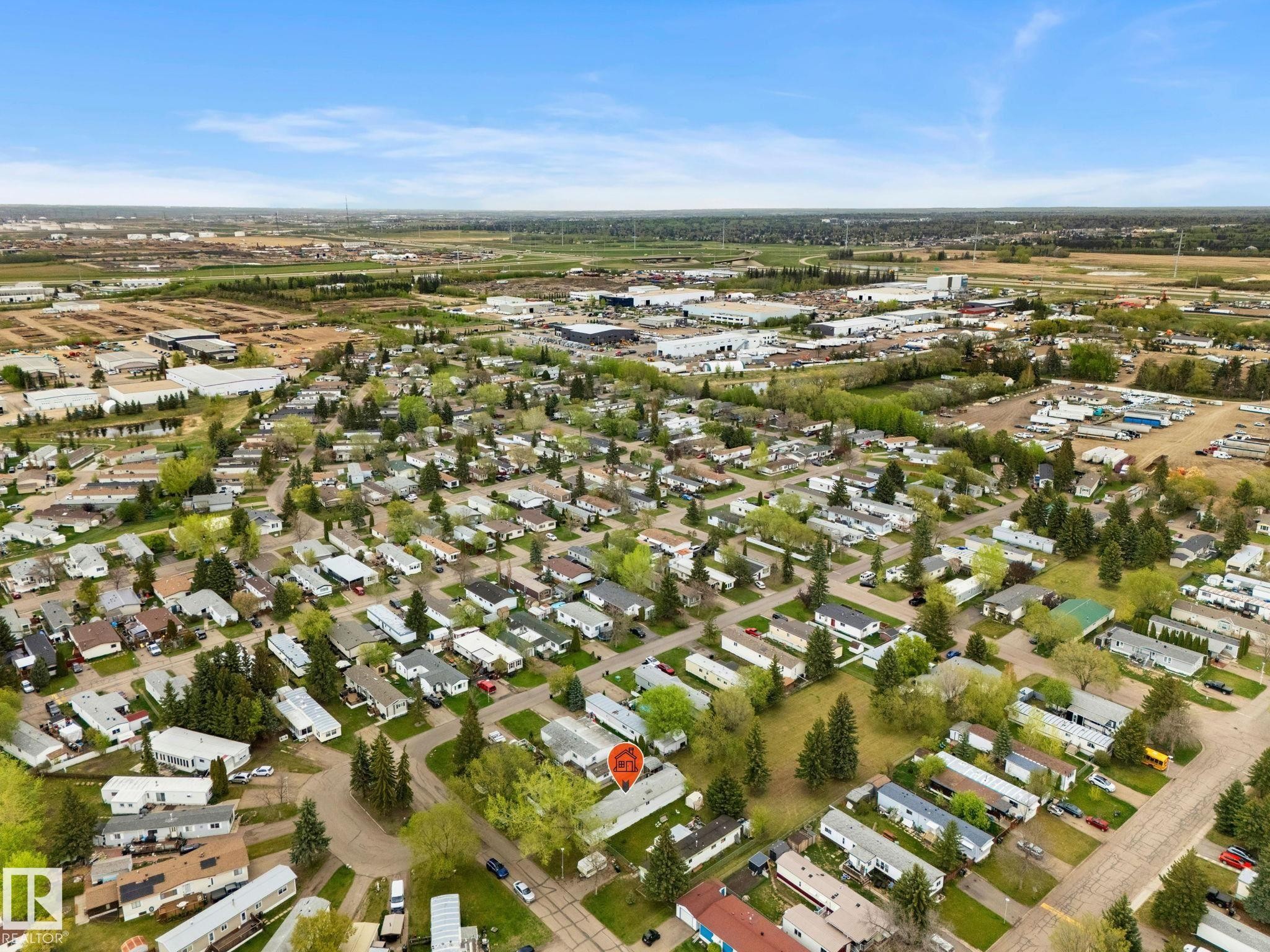Aerial perspective showcasing a residential community with abundant mature trees and individual properties - 49 Rim Road Nw, Edmonton, AB - Outdoor With View