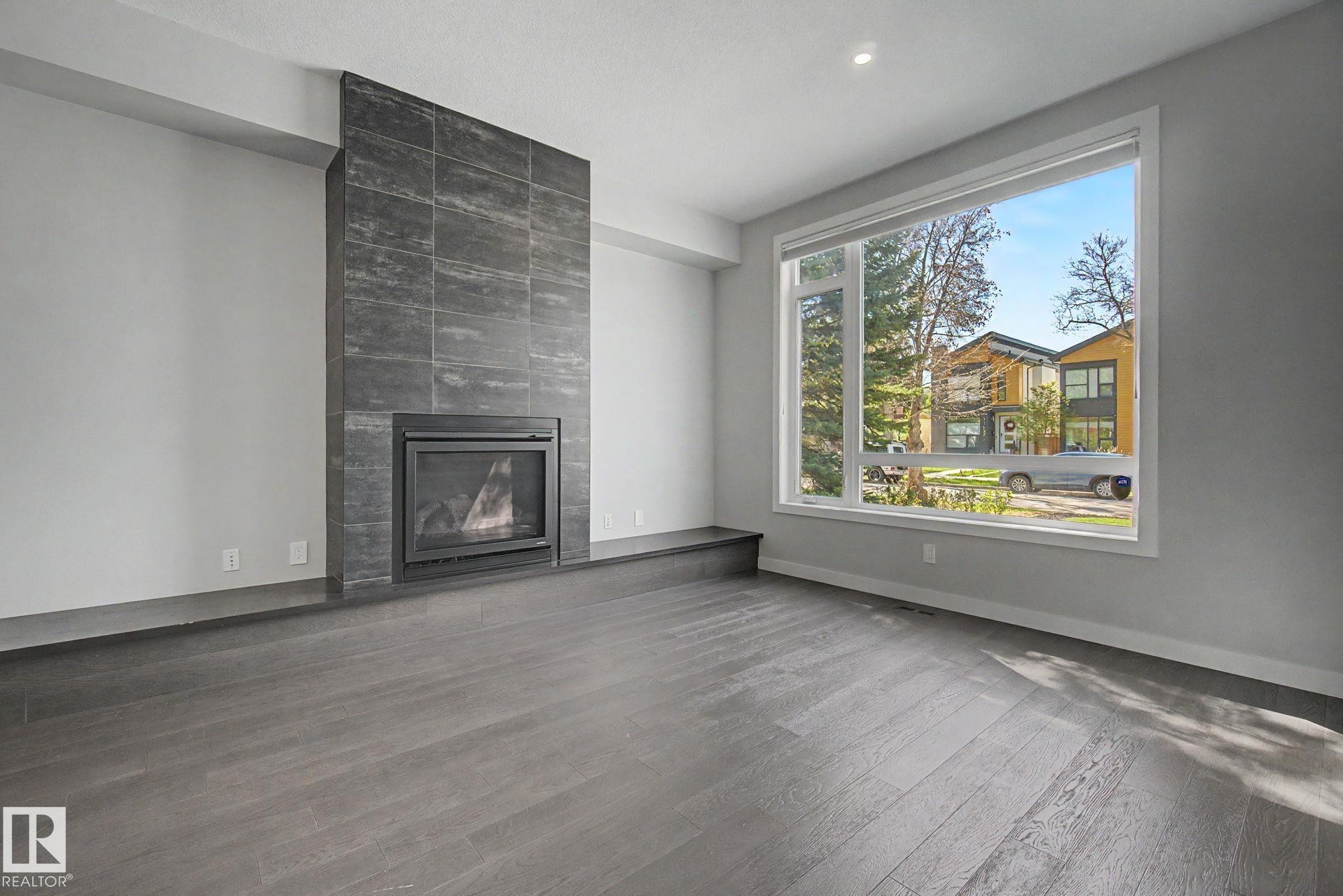 11430 75 Avenue, Edmonton, AB - Indoor Photo Showing Living Room With Fireplace
