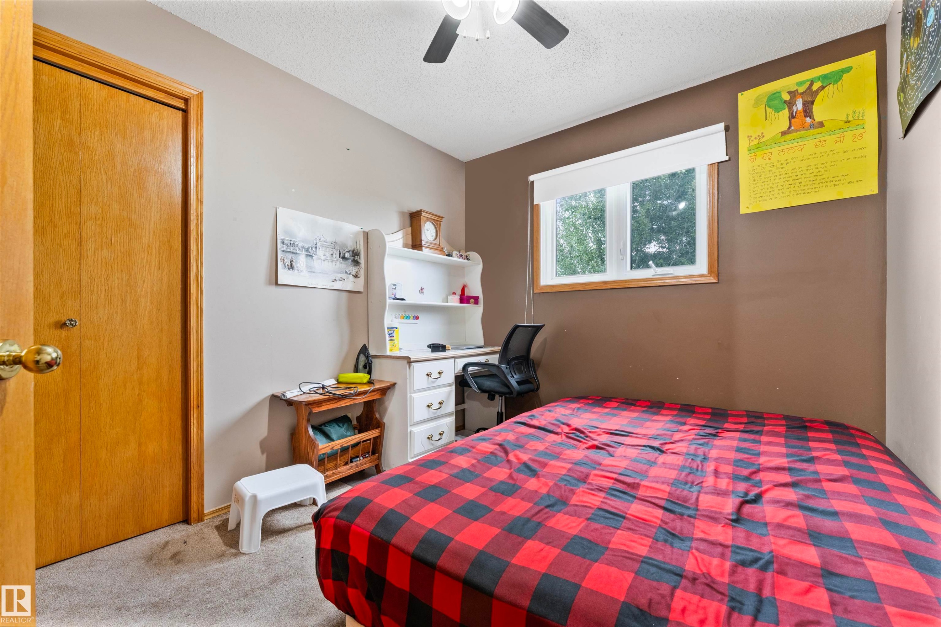 Room featuring a wood-trimmed window, neutral wall paint, and a built-in ceiling fan with light fixture - 4231 32 Avenue, Edmonton, AB - Indoor Photo Showing Bedroom
