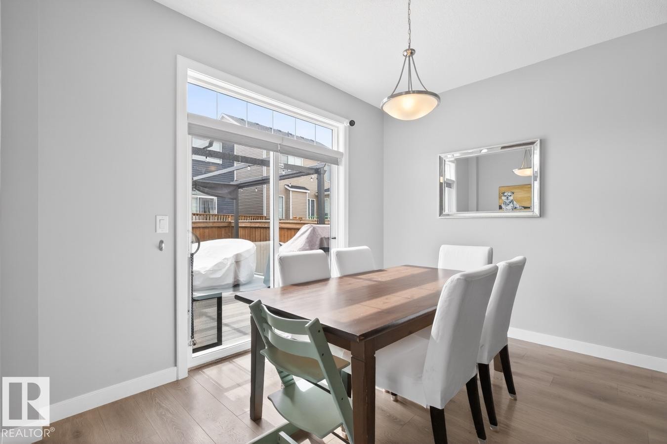 Open Concept Dining Room Space with South Facing Patio Doors leading to your Private Yard and Deck Space. Enough room to fit a table for 6+! - 20023 17A Avenue, Edmonton, AB - Indoor Photo Showing Dining Room
