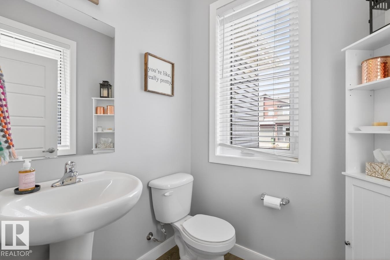 Main Floor 2 Piece Bathroom featuring Pedestal Sink and Ample Space to Add in Stylish Storage! - 20023 17A Avenue, Edmonton, AB - Indoor Photo Showing Bathroom