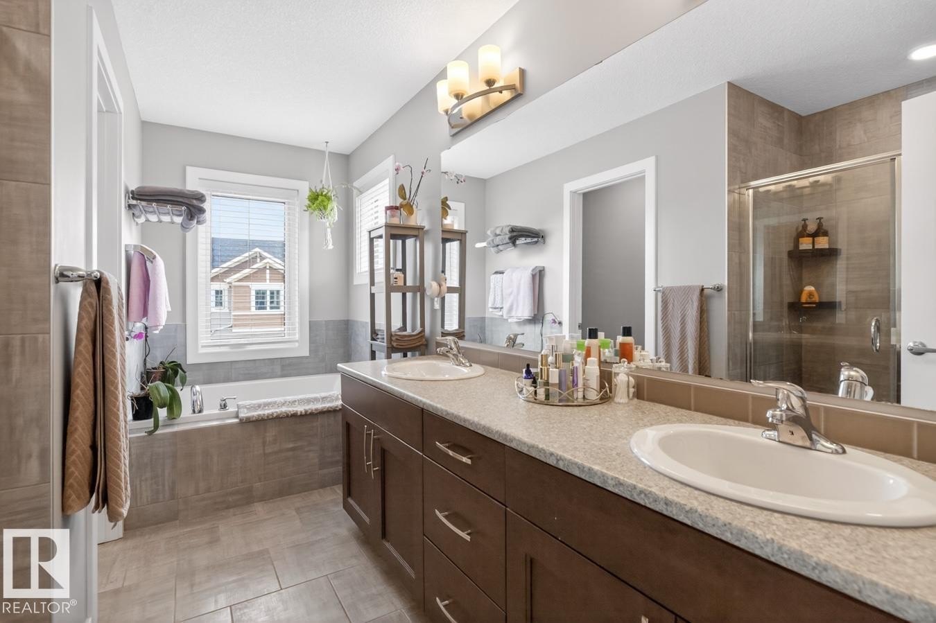 5 Piece Ensuite featuring Glass Shower, Large Soaker Tub, Double Vanity, and Separate Water Closet. Impressive Amounts of Storage and Counter Space. - 20023 17A Avenue, Edmonton, AB - Indoor Photo Showing Bathroom