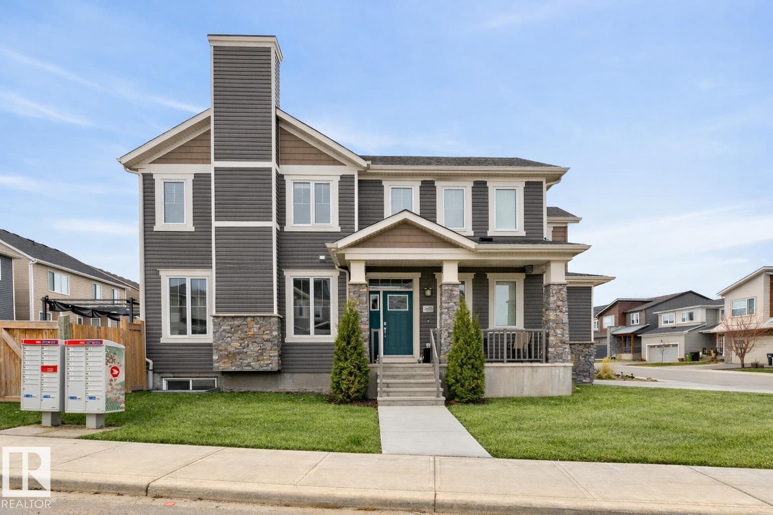 Exterior Front of Home featuring Double Garage, Corner Lot facing North West. Extra Windows Throughout. - 20023 17A Avenue, Edmonton, AB - Outdoor With Facade
