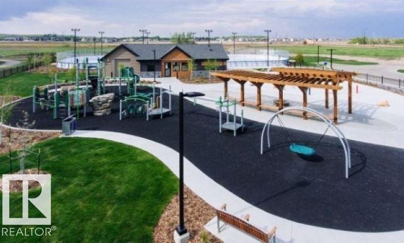 The private park area is for the exclusive use of the members and guests. The park is available year-round and features a spray park, playground, a clubhouse and and an outdoor ice-skating rink. - 20023 17A Avenue, Edmonton, AB - Outdoor
