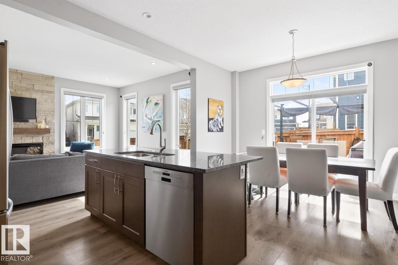 Stylish Kitchen featuring Quartz Counters, Stainless Steel Appliances (Bosh Dishwasher, Whirlpool Refrigerator, LG GAS Stove, LG Microwave Hood Fan), Subway Tile Backsplash, and plenty of Counter and Cabinet Space. - 20023 17A Avenue, Edmonton, AB - Indoor