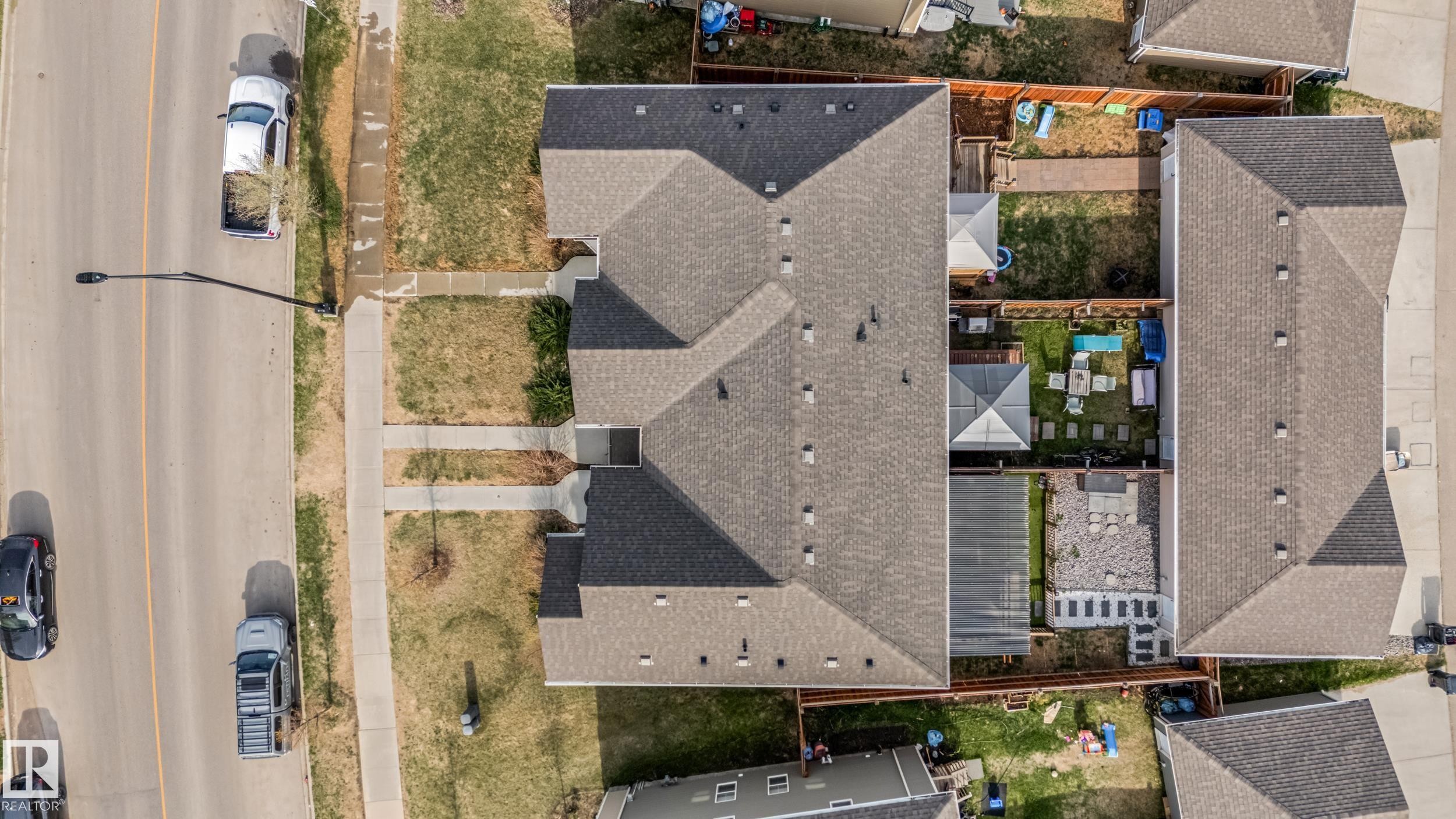 Overhead perspective showcasing a multi-unit property with a shingled roof and individual backyard spaces - 8131 Chappelle Way, Edmonton, AB - Outdoor