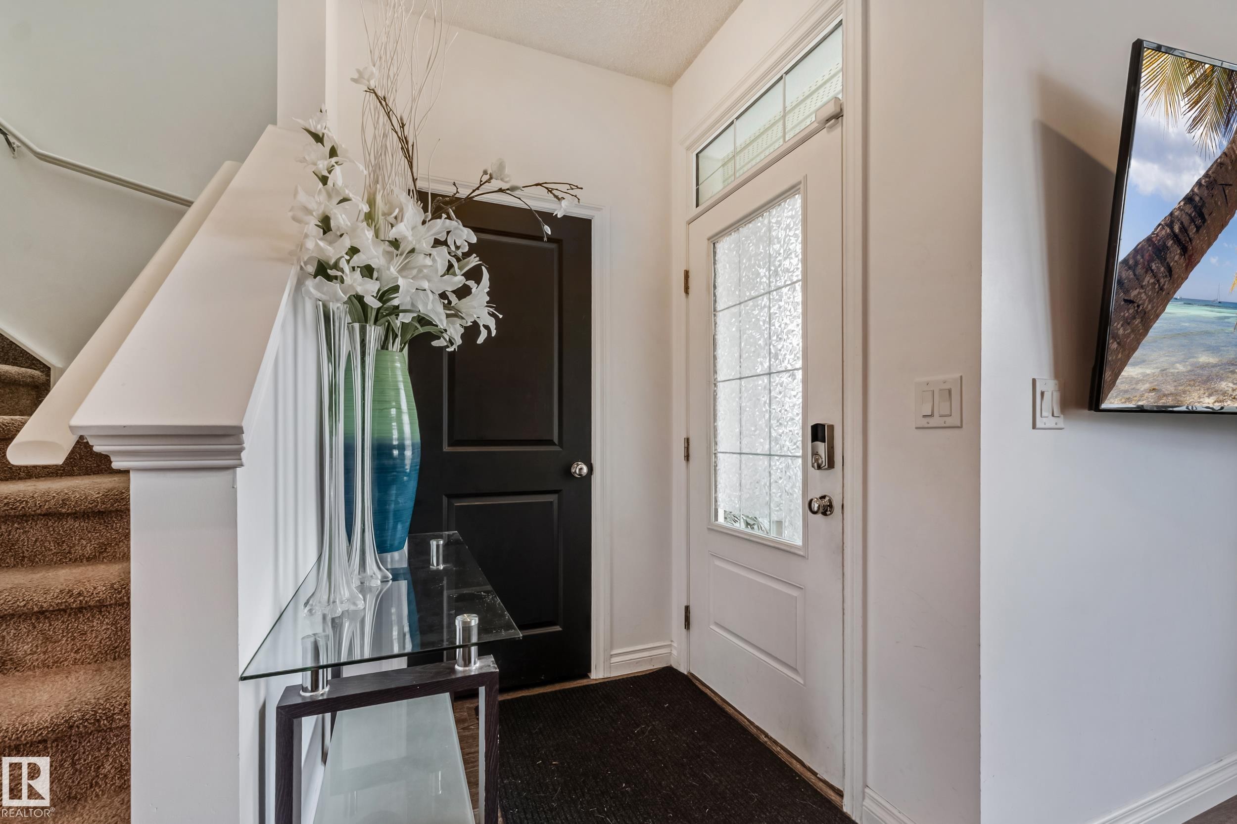 Entryway featuring a white door with decorative glass panels and a transom window - 8131 Chappelle Way, Edmonton, AB - Indoor Photo Showing Other Room