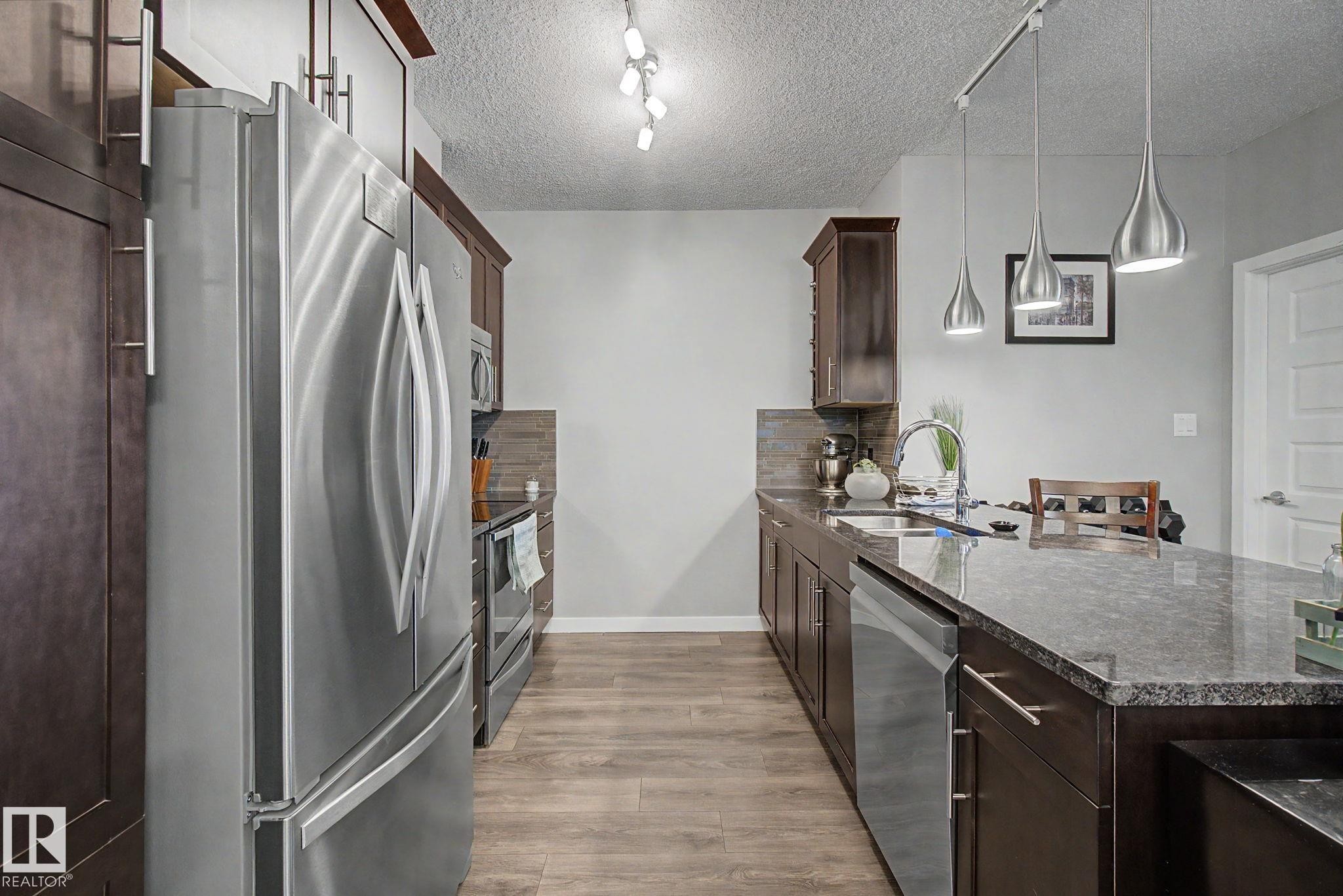 129 503 Albany Way, Edmonton, AB - Indoor Photo Showing Kitchen With Double Sink With Upgraded Kitchen