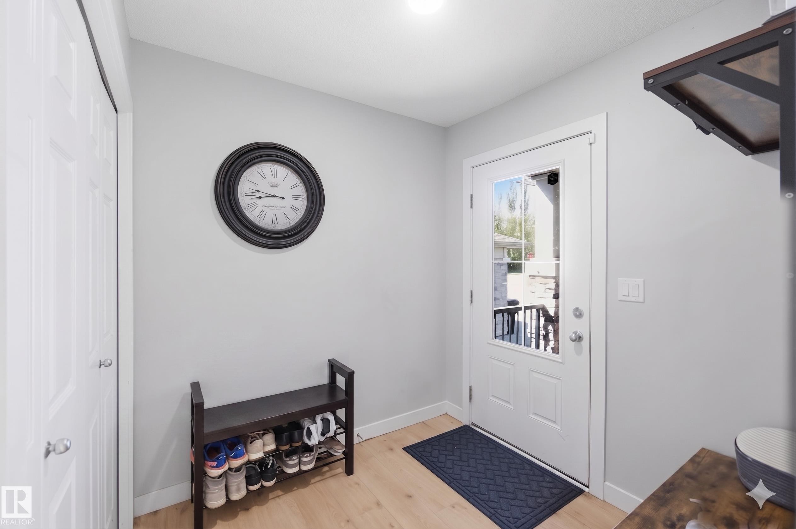 Entryway featuring light wood-finish flooring and neutral wall tones - 5129 Lark Crescent, Edmonton, AB - Indoor Photo Showing Other Room