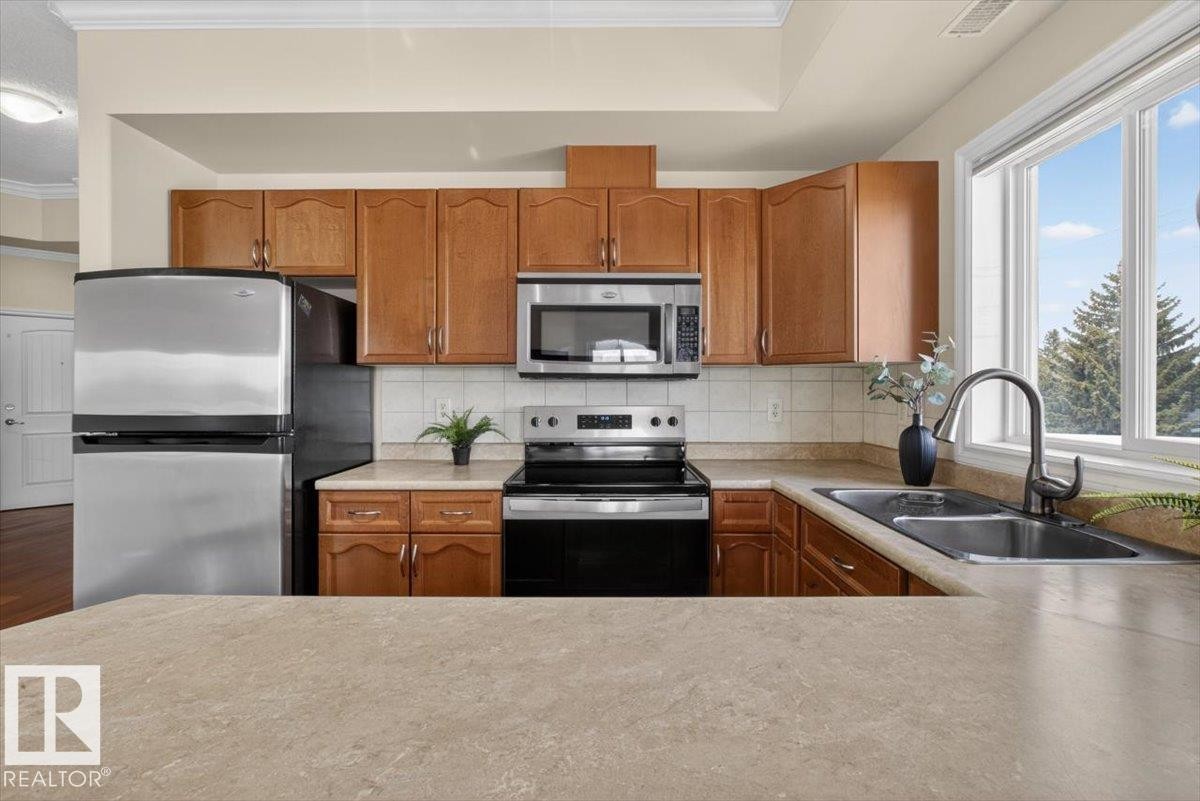 326 8528 82 Avenue, Edmonton, AB - Indoor Photo Showing Kitchen With Stainless Steel Kitchen With Double Sink