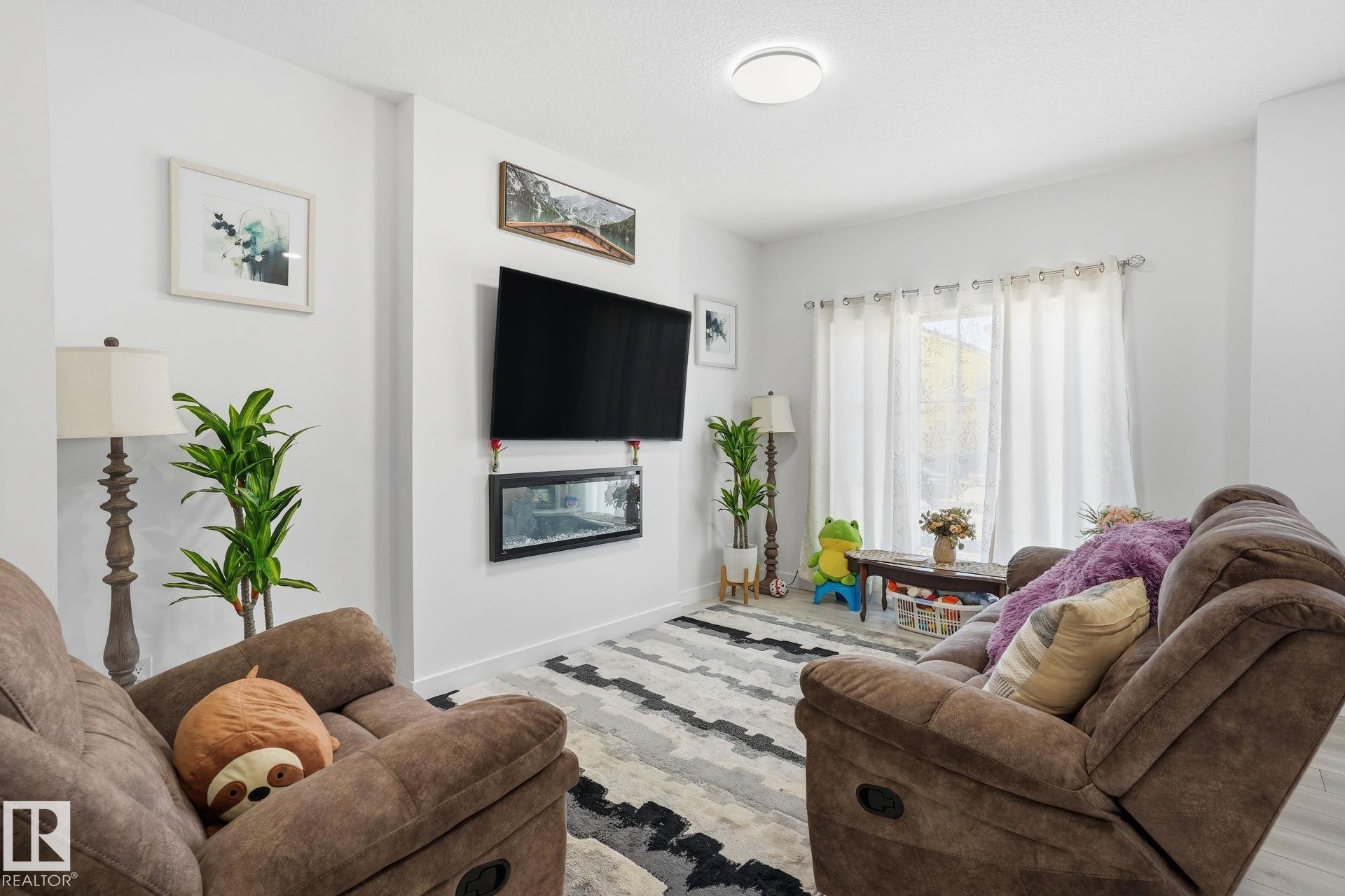65 Covell Common, Spruce Grove, AB - Indoor Photo Showing Living Room With Fireplace