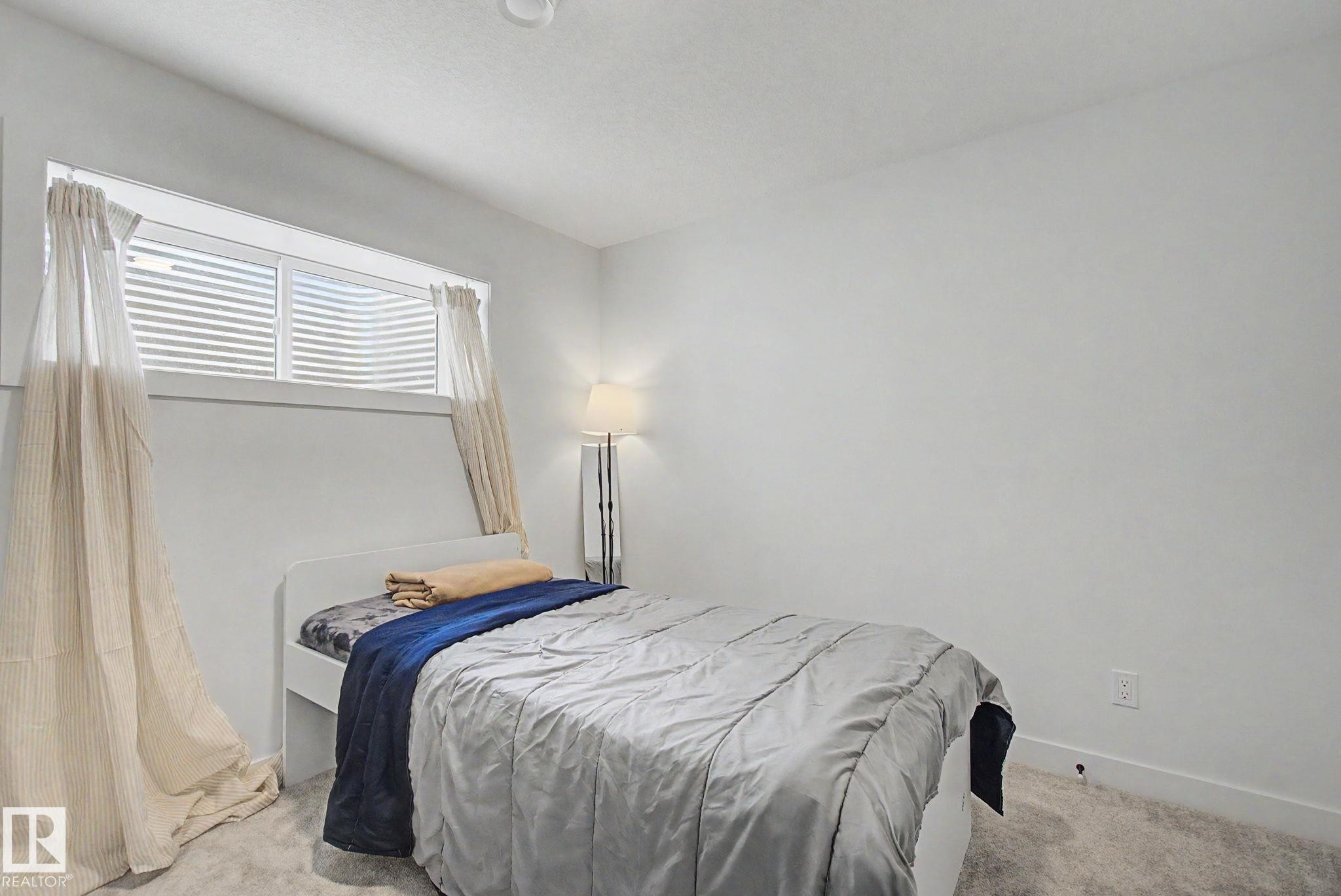 117 Brickyard Drive, Stony Plain, AB - Indoor Photo Showing Bedroom