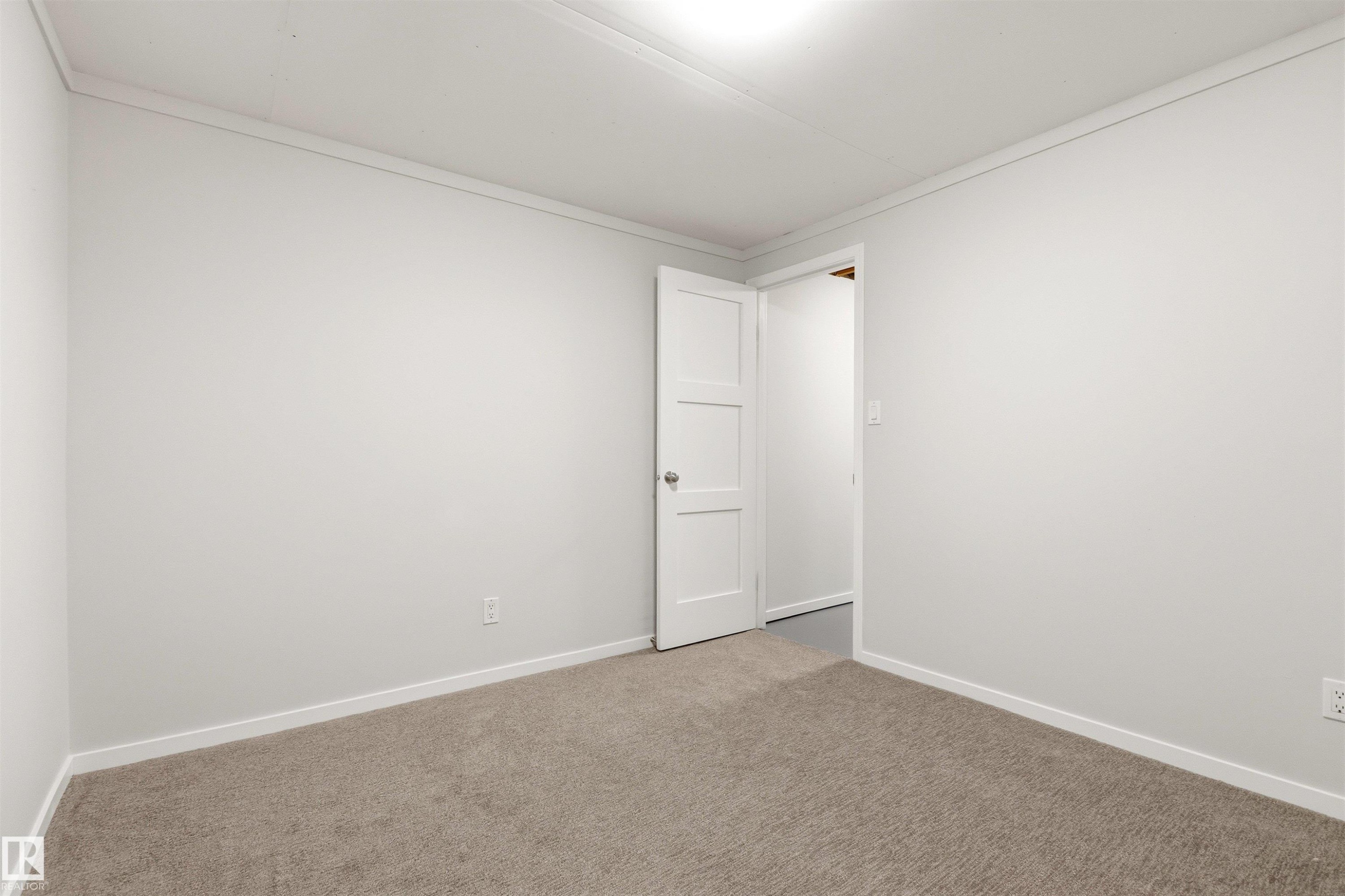Light gray wall finishes with white trim and crown molding - 707 Clareview Road, Edmonton, AB - Indoor Photo Showing Other Room