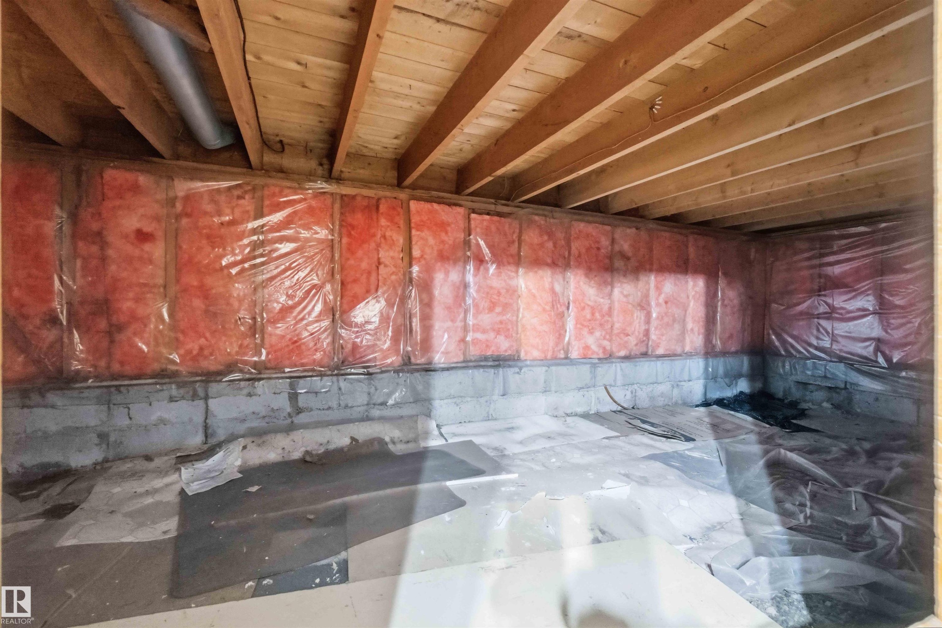 Unfinished basement space featuring exposed wood joists and structural beams - 16 Michigan Street, Devon, AB - Indoor Photo Showing Basement