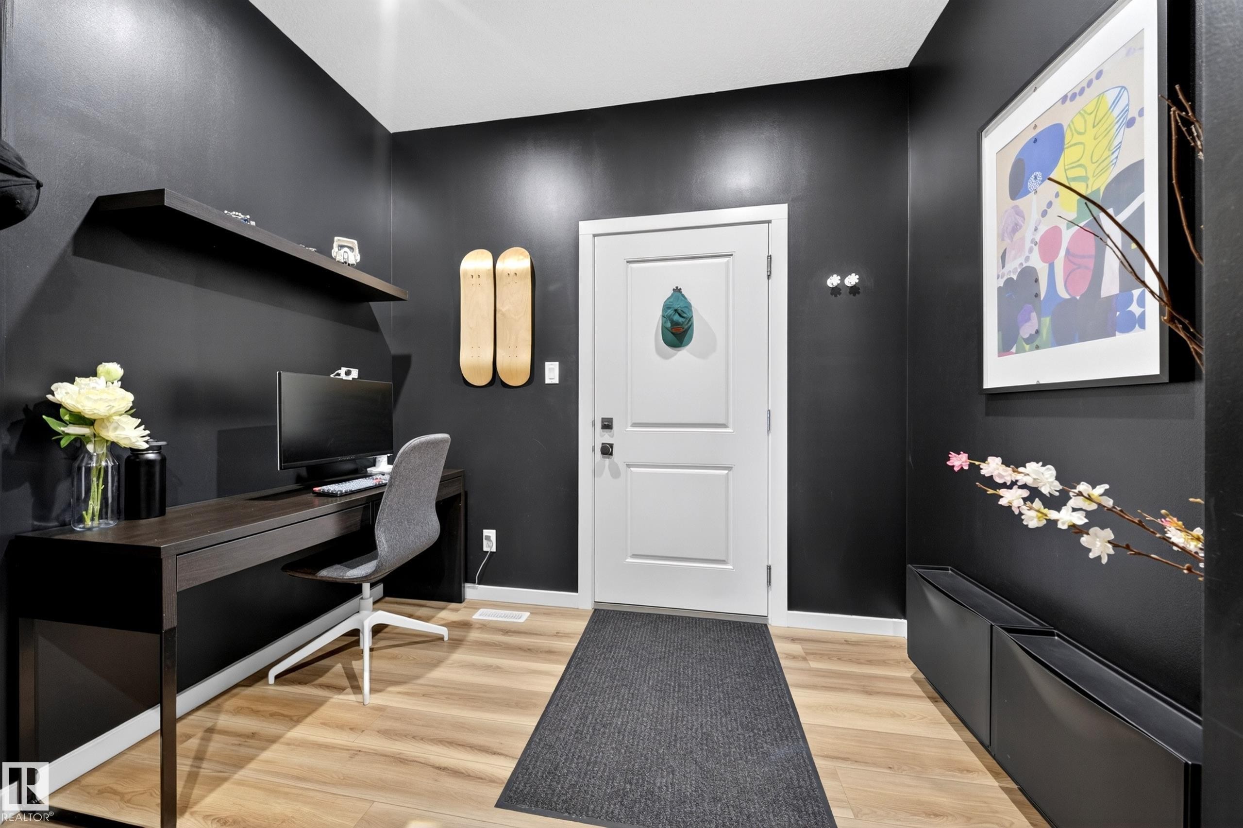 Dark-toned walls complement light wood-finish flooring - 3337 Kulay Way, Edmonton, AB - Indoor