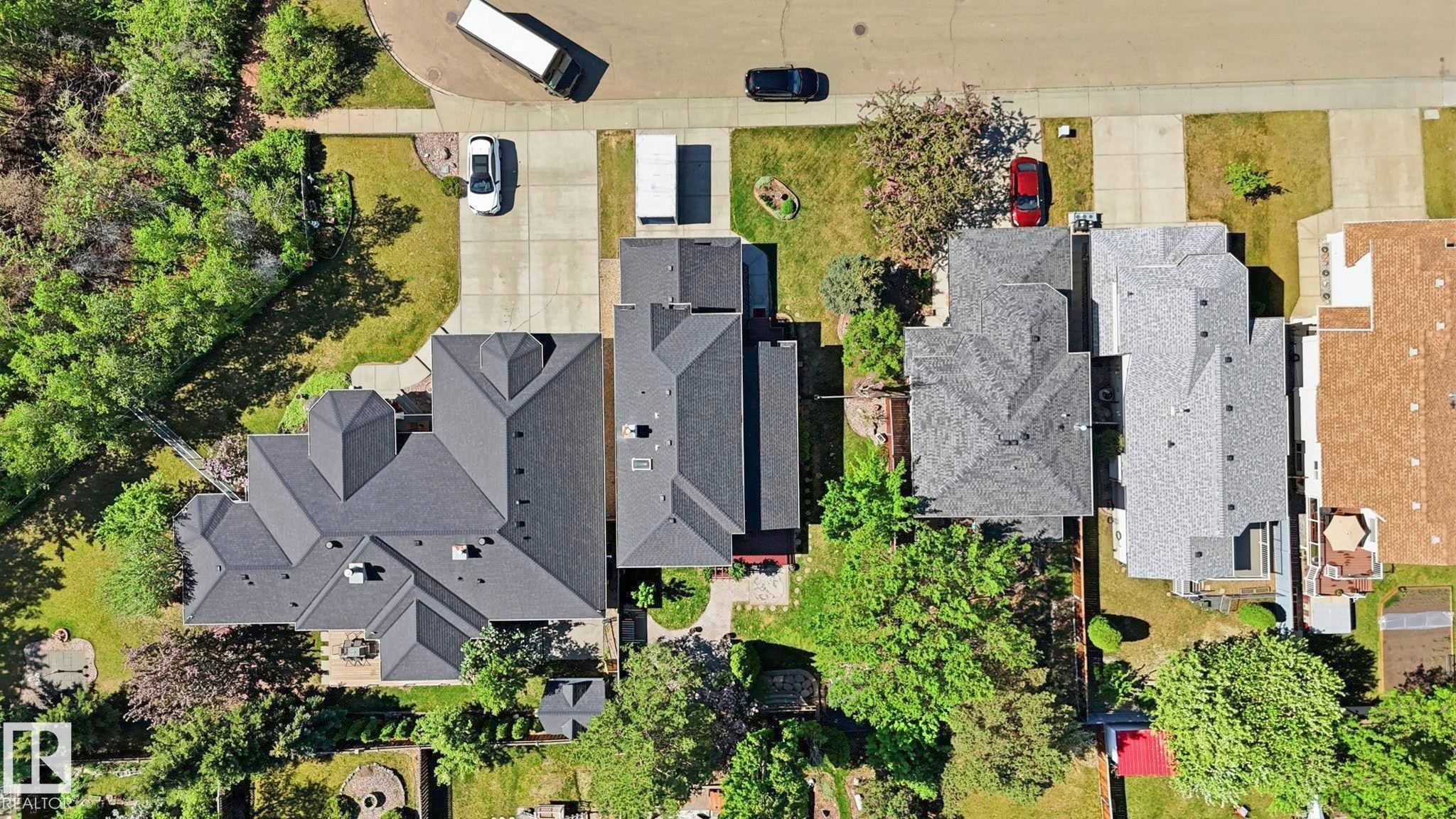 Residential property featuring a multi-gabled roofline and surrounding mature trees - 4309 37A Avenue, Edmonton, AB - Outdoor