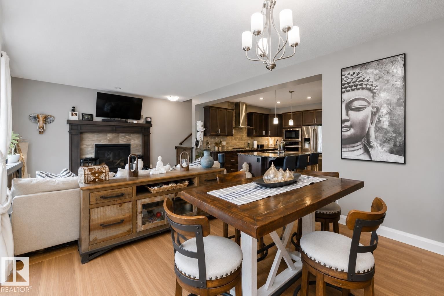 153 Sturtz Bend, Leduc, AB - Indoor Photo Showing Dining Room With Fireplace