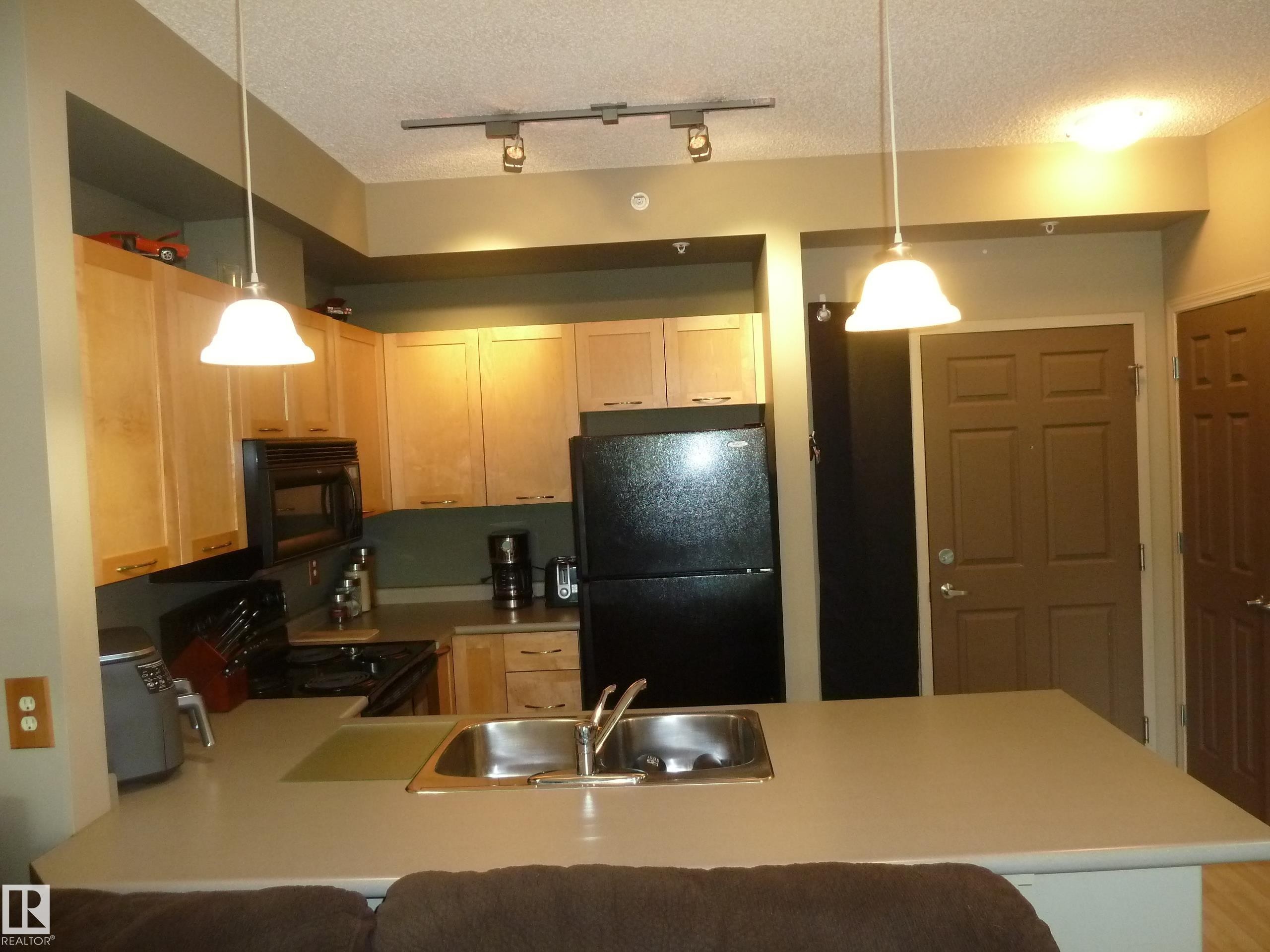 1-104 4245 139 Avenue, Edmonton, AB - Indoor Photo Showing Kitchen With Double Sink