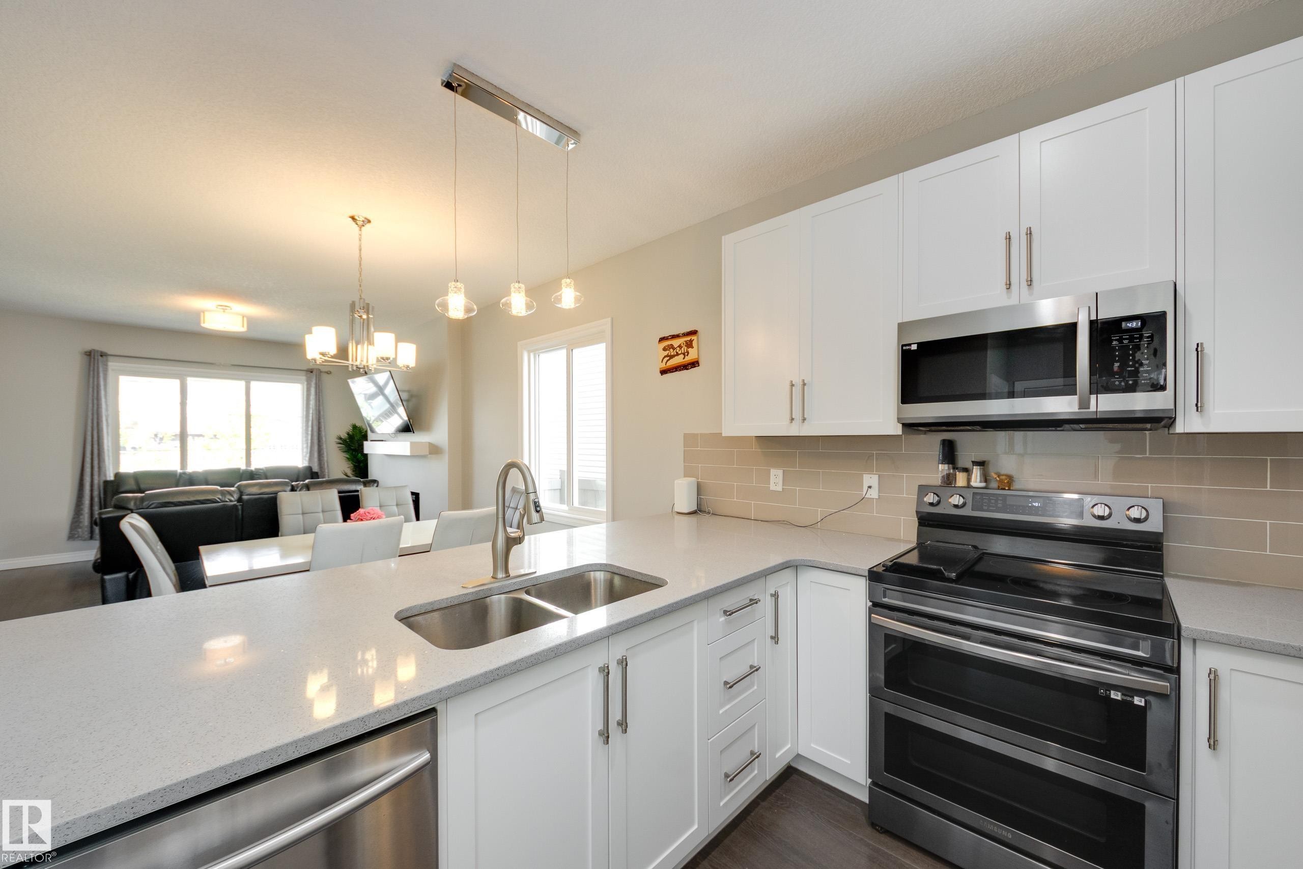 6687 Cardinal Road, Edmonton, AB - Indoor Photo Showing Kitchen With Double Sink